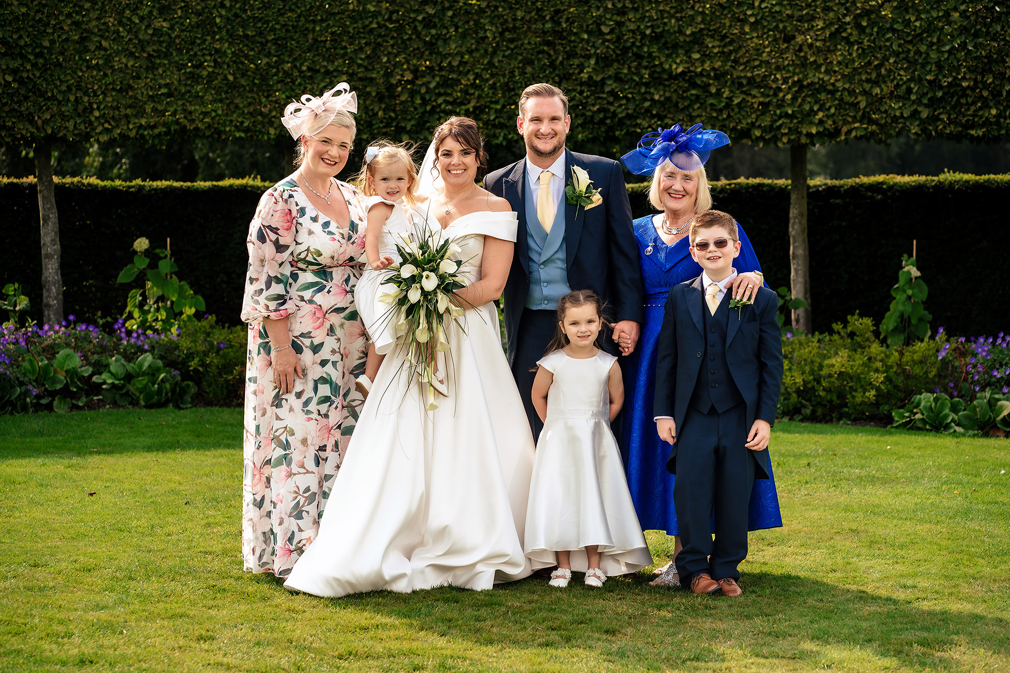 A smaller family group photo on the lawn, Merrydale Manor wedding photographer