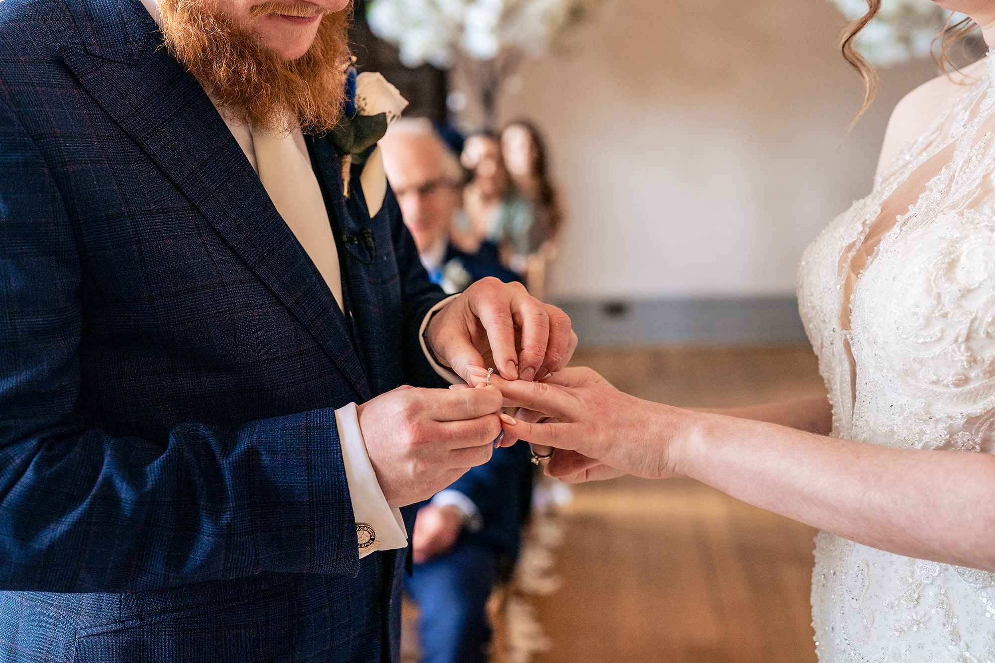 Close up of the wedding ring being placed during the ceremony, Salt House wedding photographer