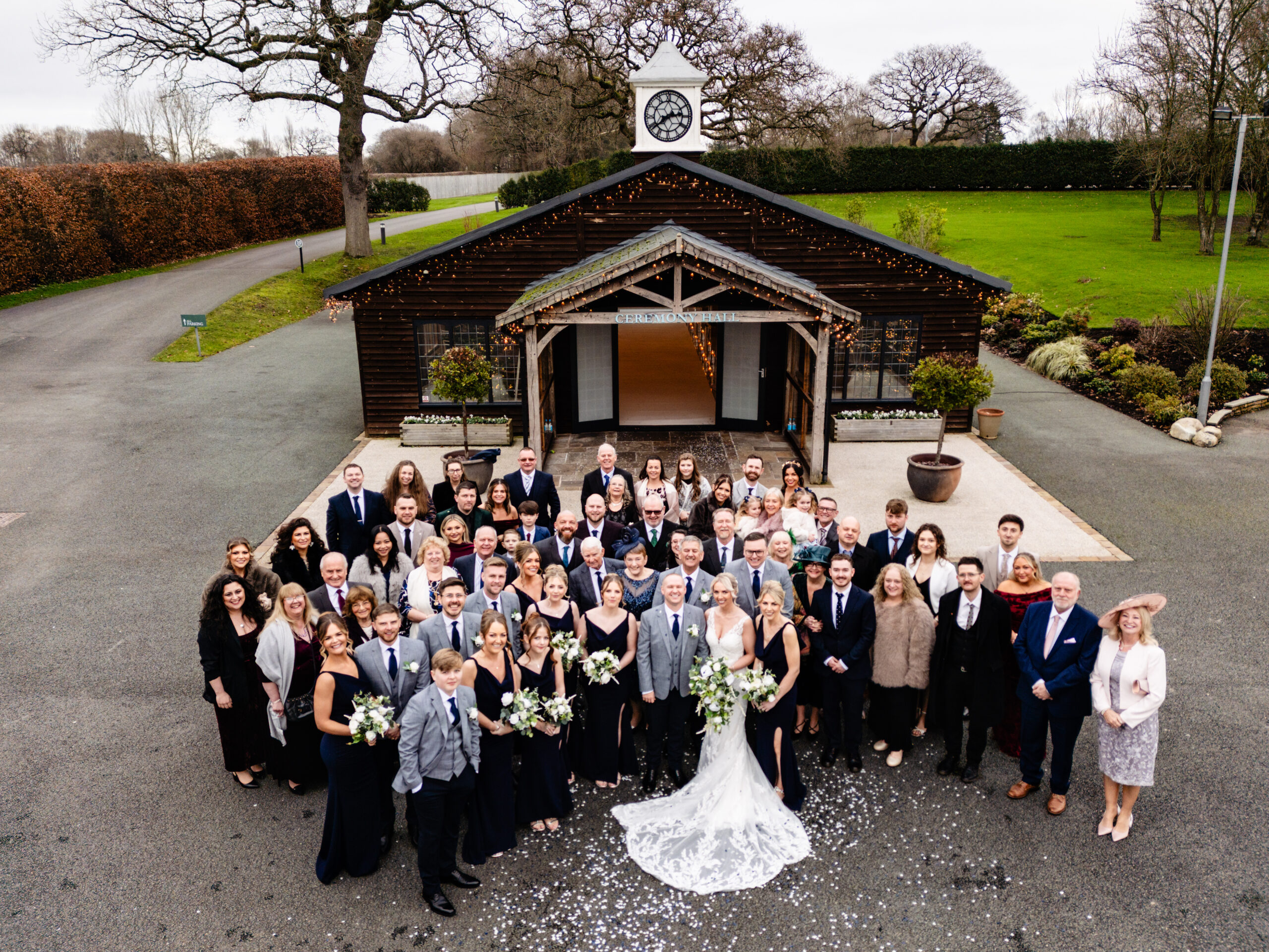 Every guest gathered outside the Ceremony Hall for a group photo taken from above, Colshaw Hall Cheshire wedding