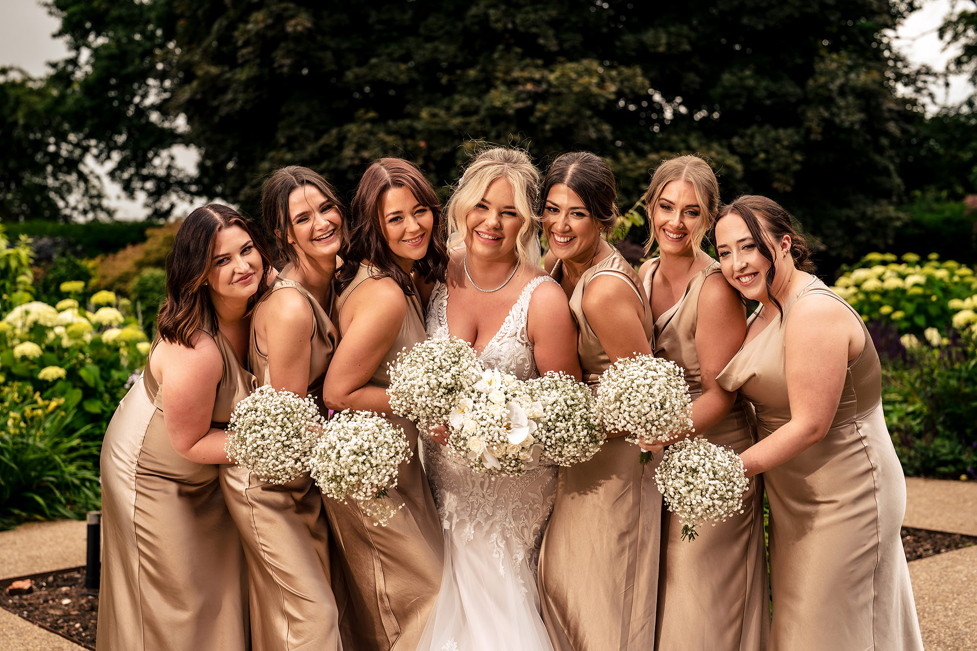 Jess and her bridesmaids sharing a laugh in the gardens at Salt House, Staffordshire