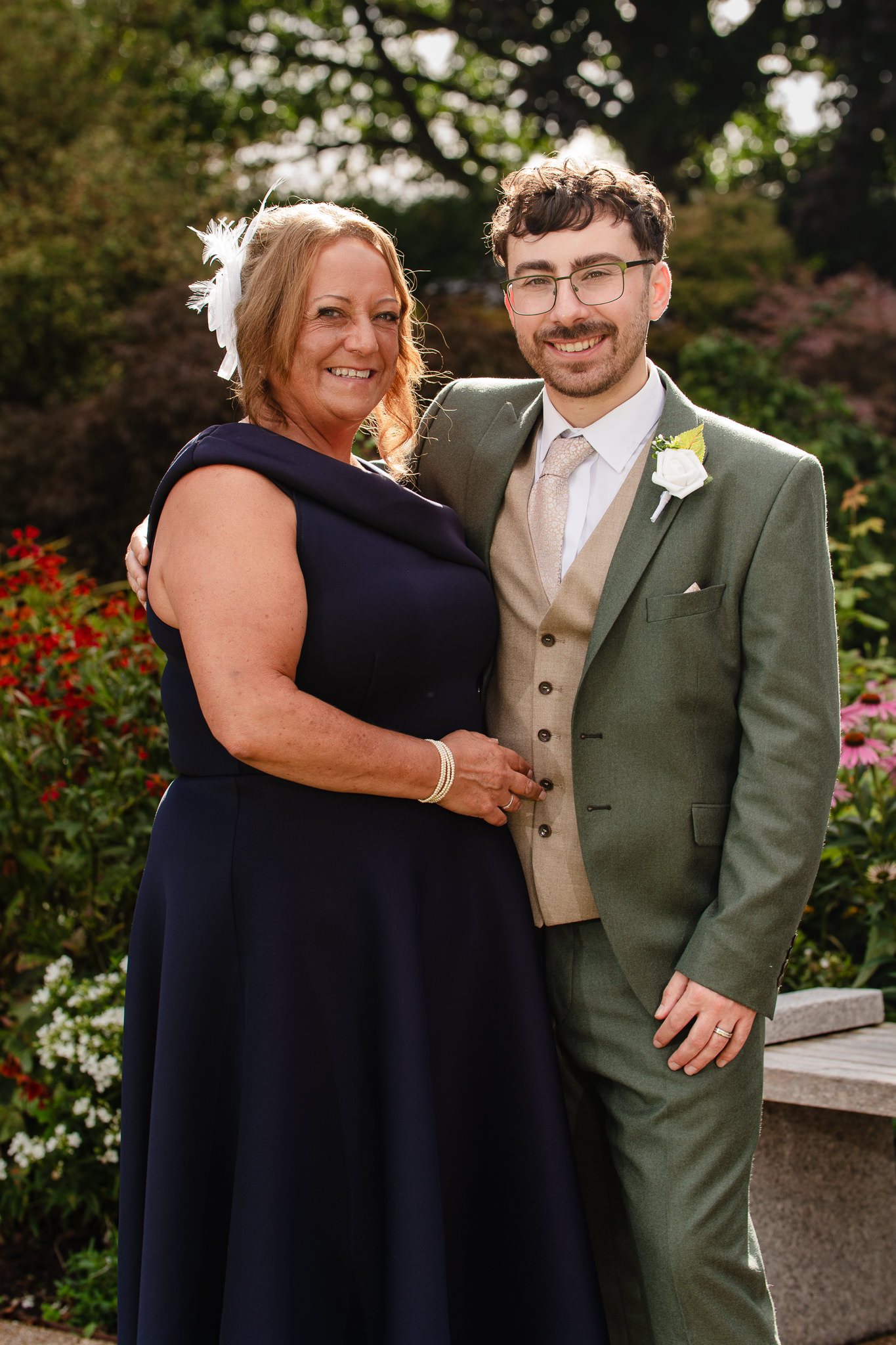 The groom with a family member, a relaxed portrait in the gardens at Salt House