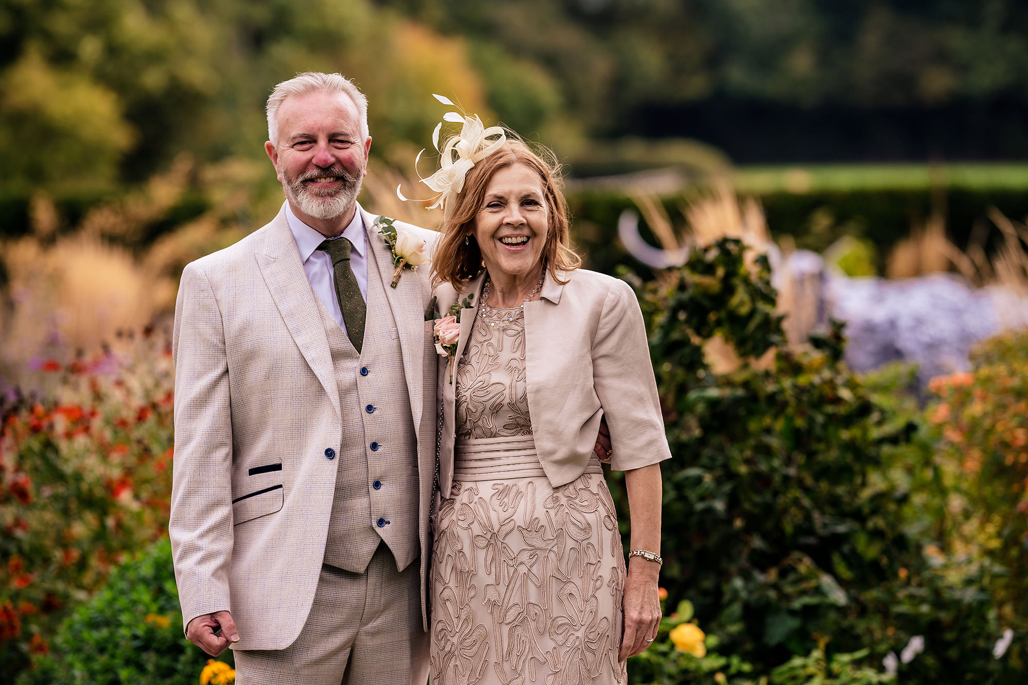 Portrait of the groom’s parents in the gardens at Standon Hall