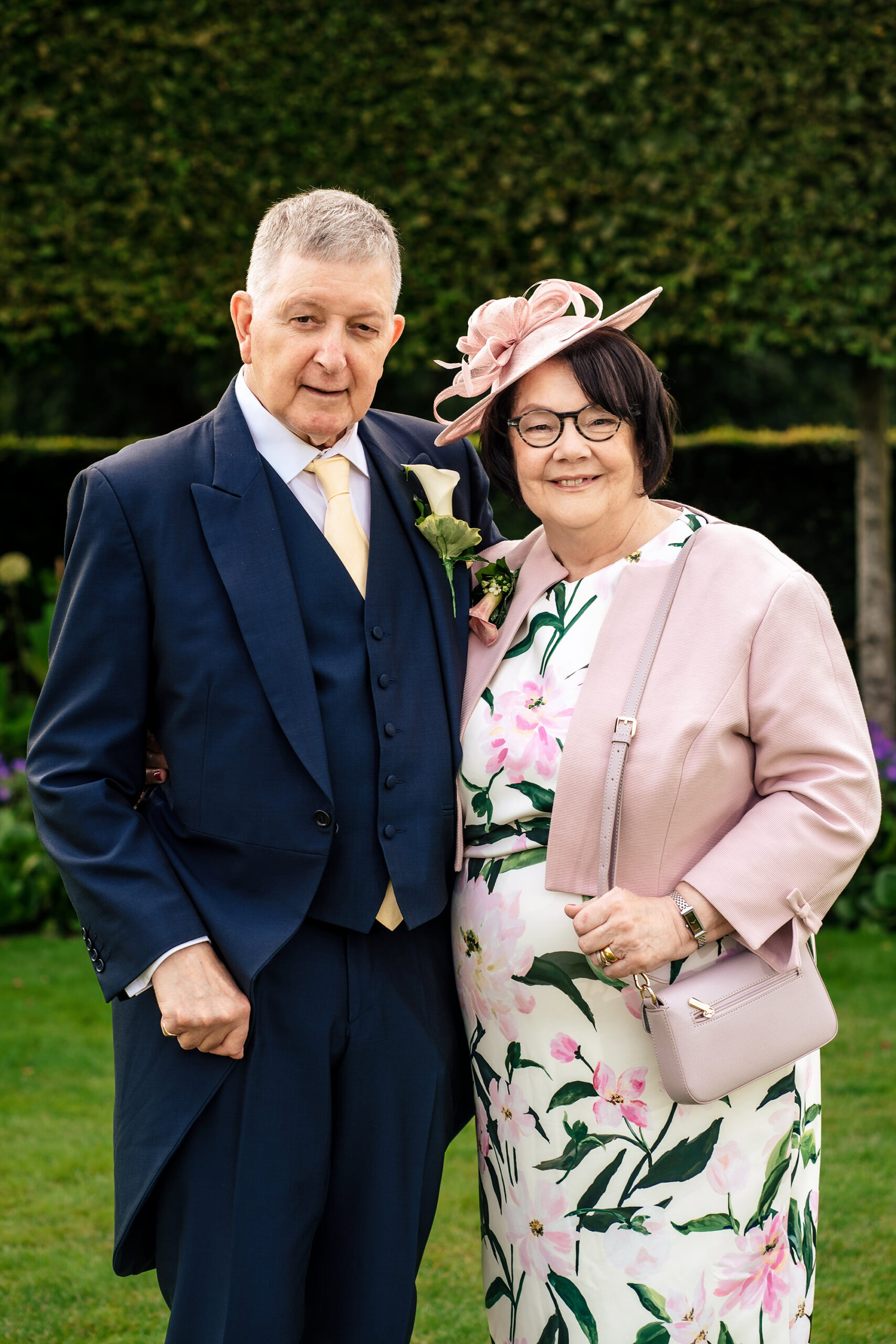 A portrait with parents on the lawn, Merrydale Manor wedding photographer
