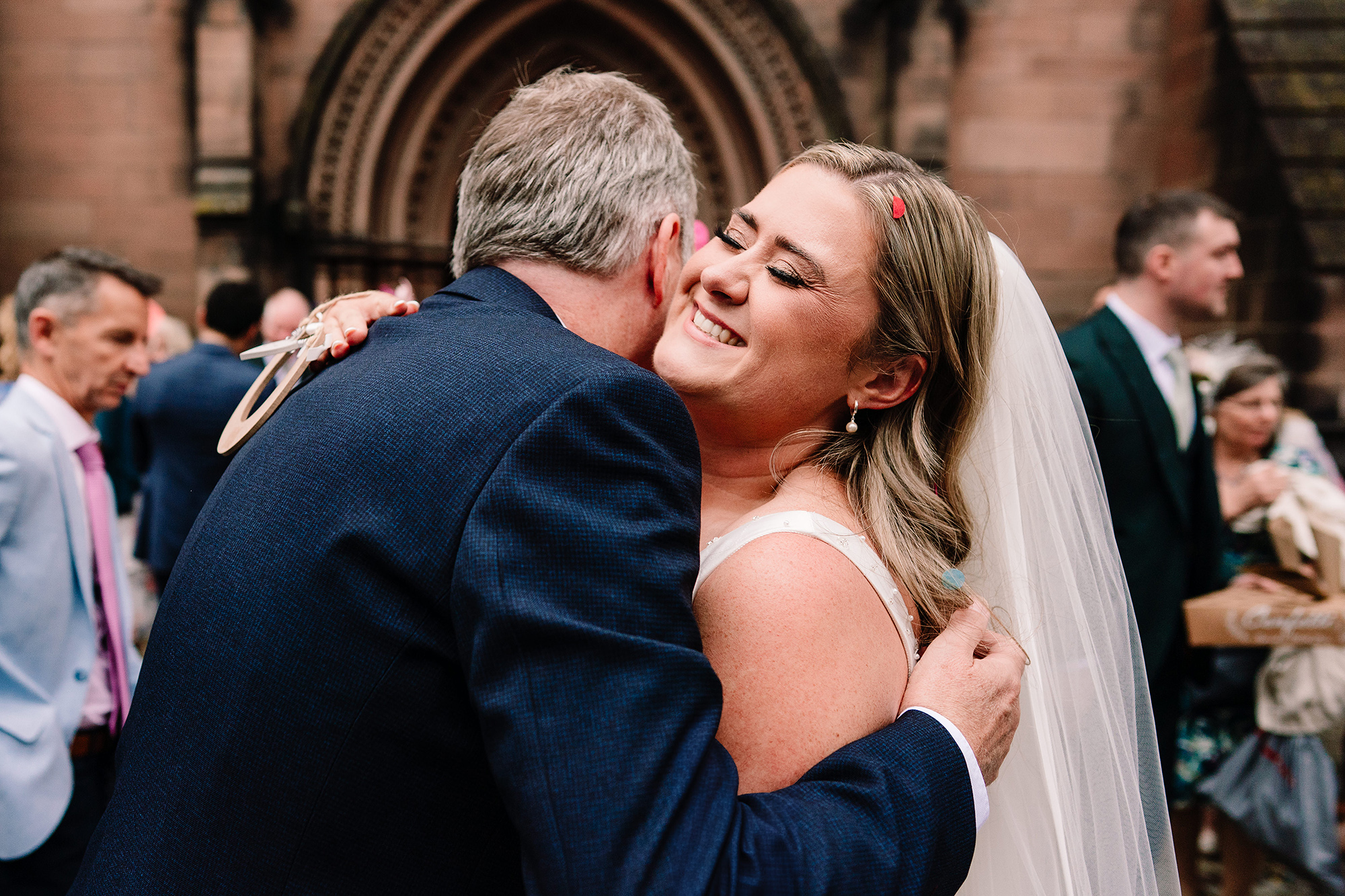 An emotional hug outside St Mary’s Church after the ceremony