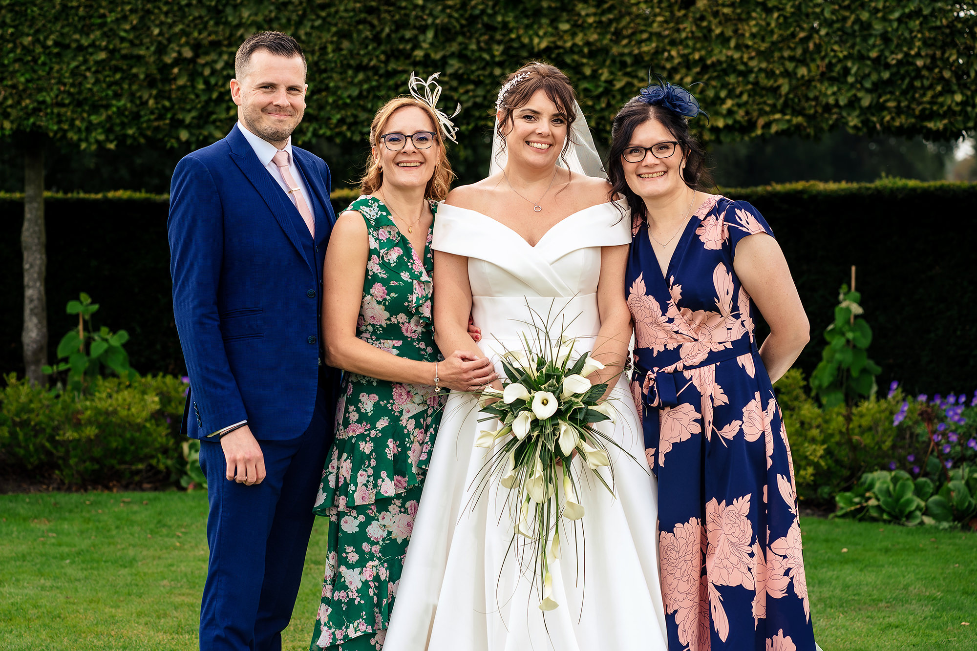 Laura and Ryan posed with a family member, Merrydale Manor wedding photographer