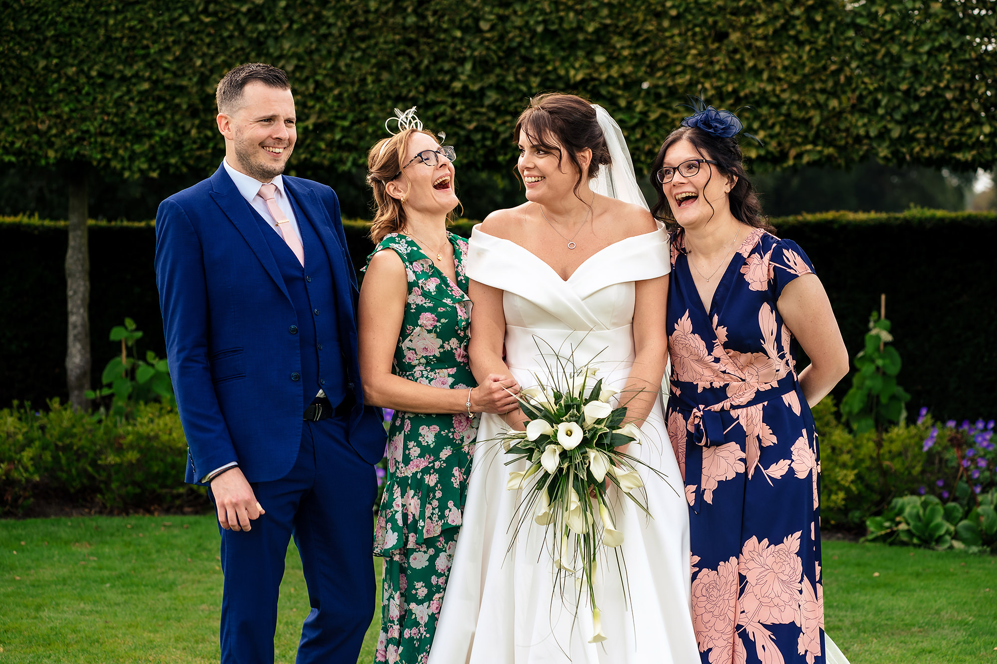 Laura and Ryan with a bridesmaid in yellow, Merrydale Manor wedding photographer