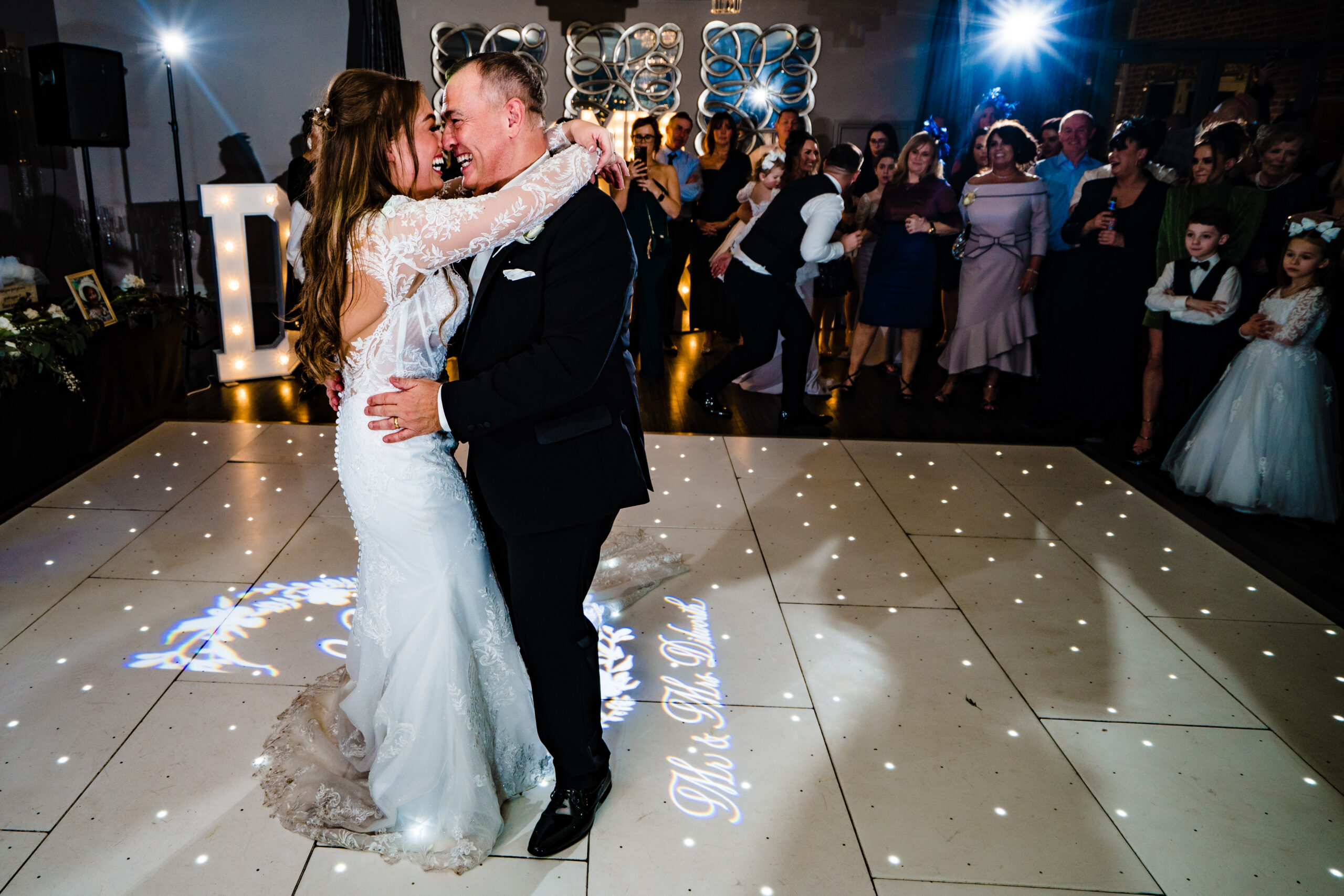Abbie and her dad dancing cheek to cheek on the dance floor, Cheshire wedding photographer