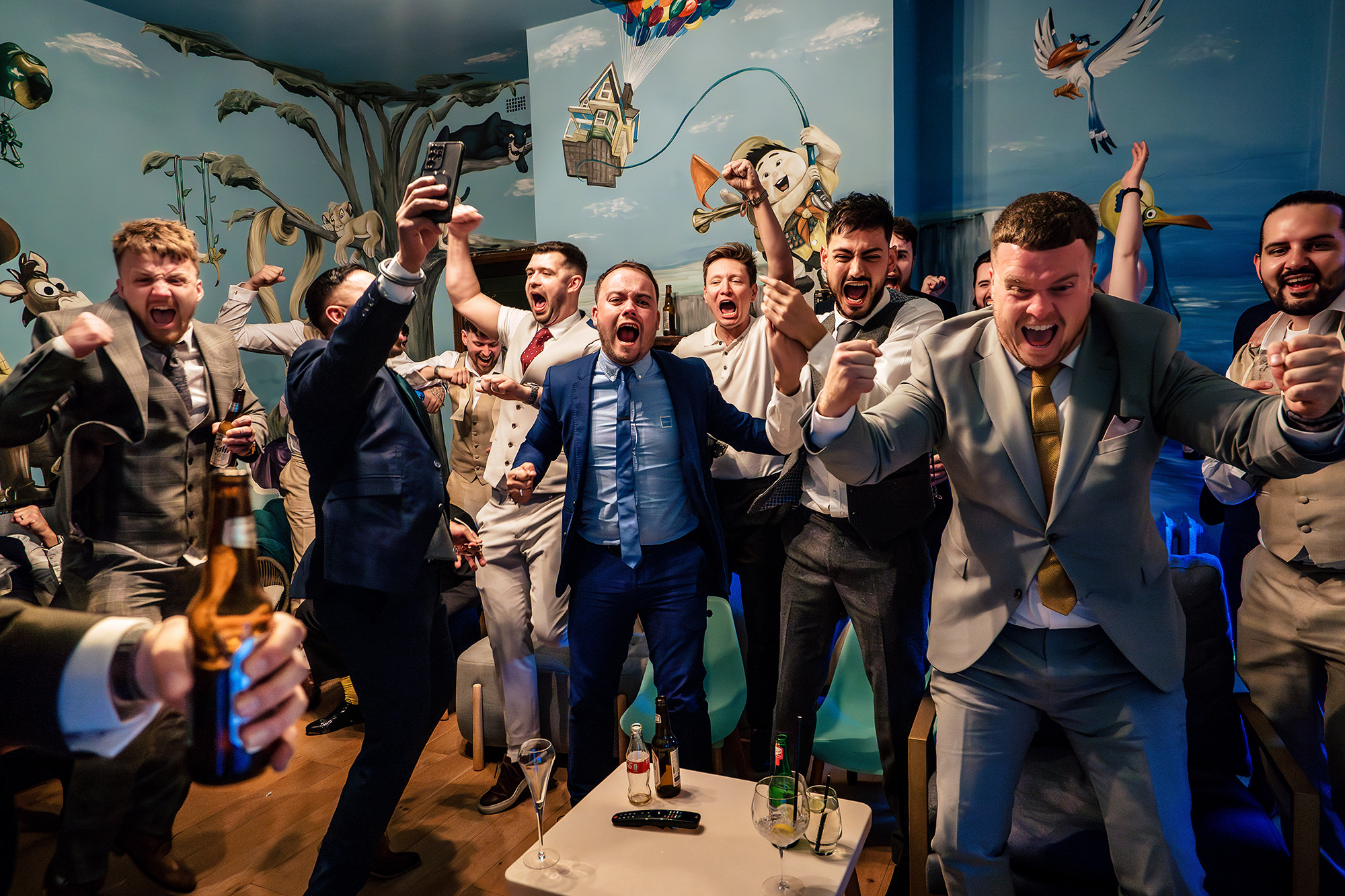 Cy and his groomsmen celebrating England’s Euro 2024 penalty shootout win over Switzerland in Salt House’s games room