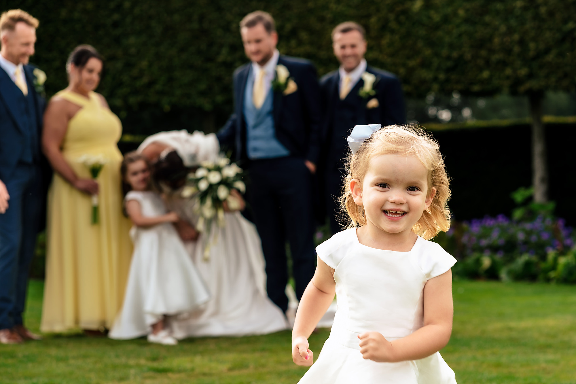 The flower girls playing on the lawn, Merrydale Manor wedding photographer
