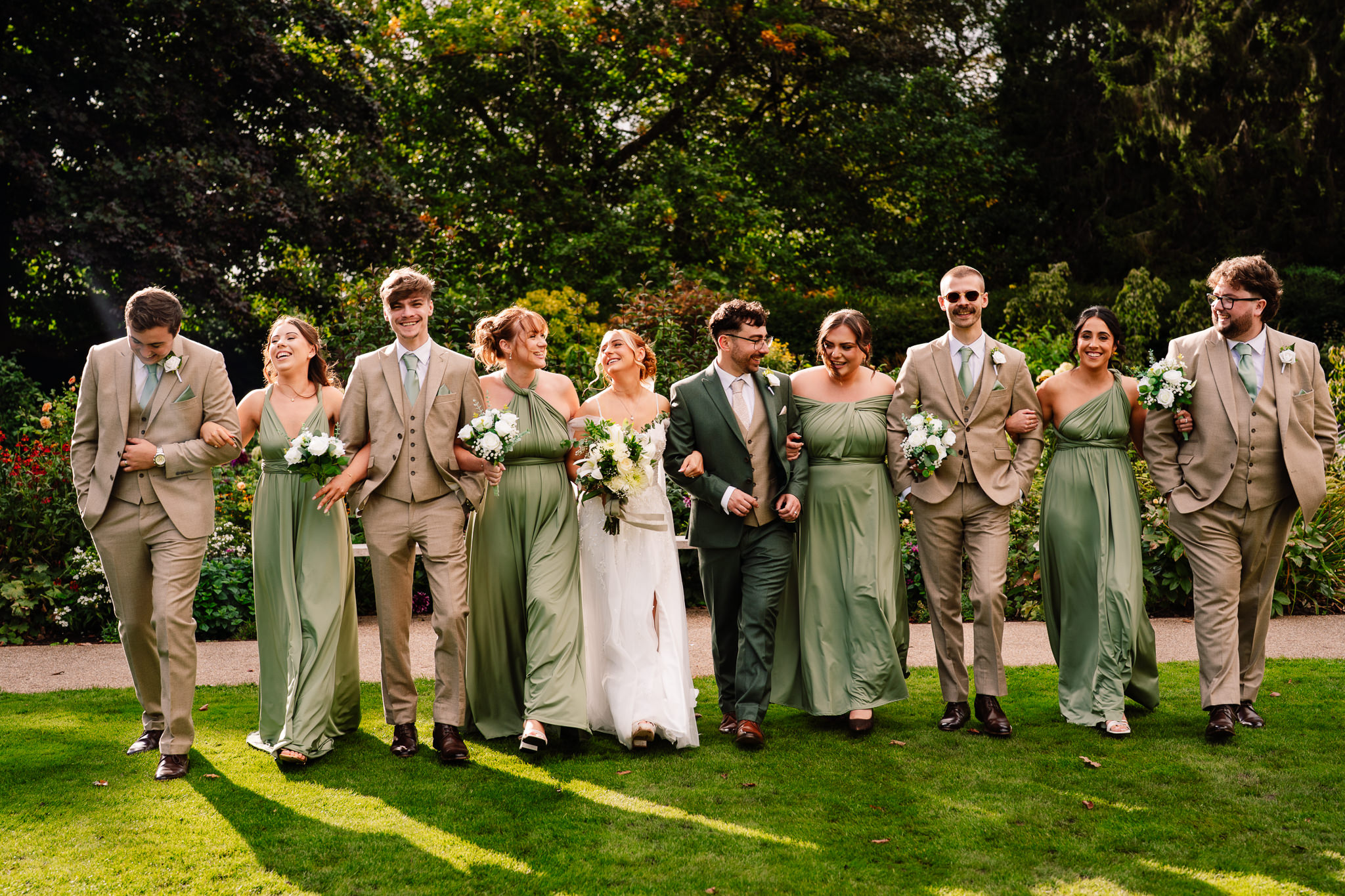Groomsmen larking about together in a playful group photo, the groom at the centre