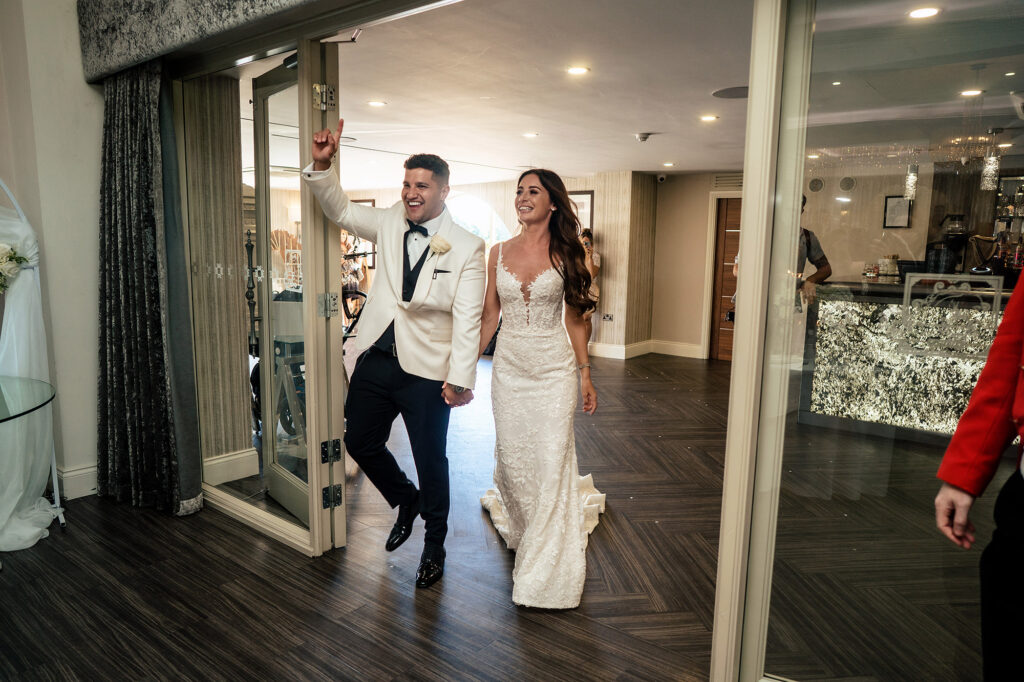 Tyrone punching the air as he and Gemma make their entrance into the wedding breakfast