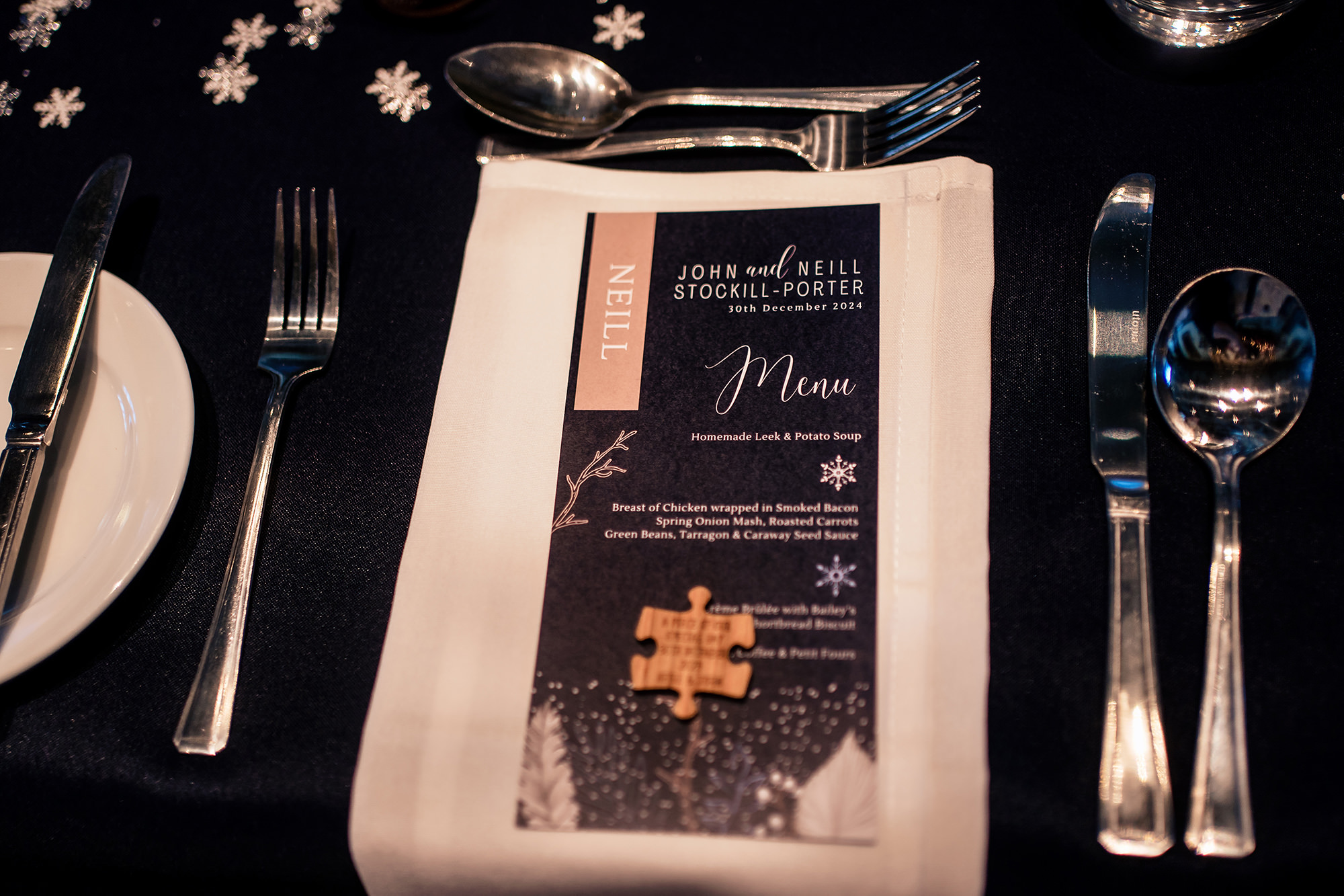 The wedding breakfast room at Crewe Hall, set and ready with its navy and gold styling