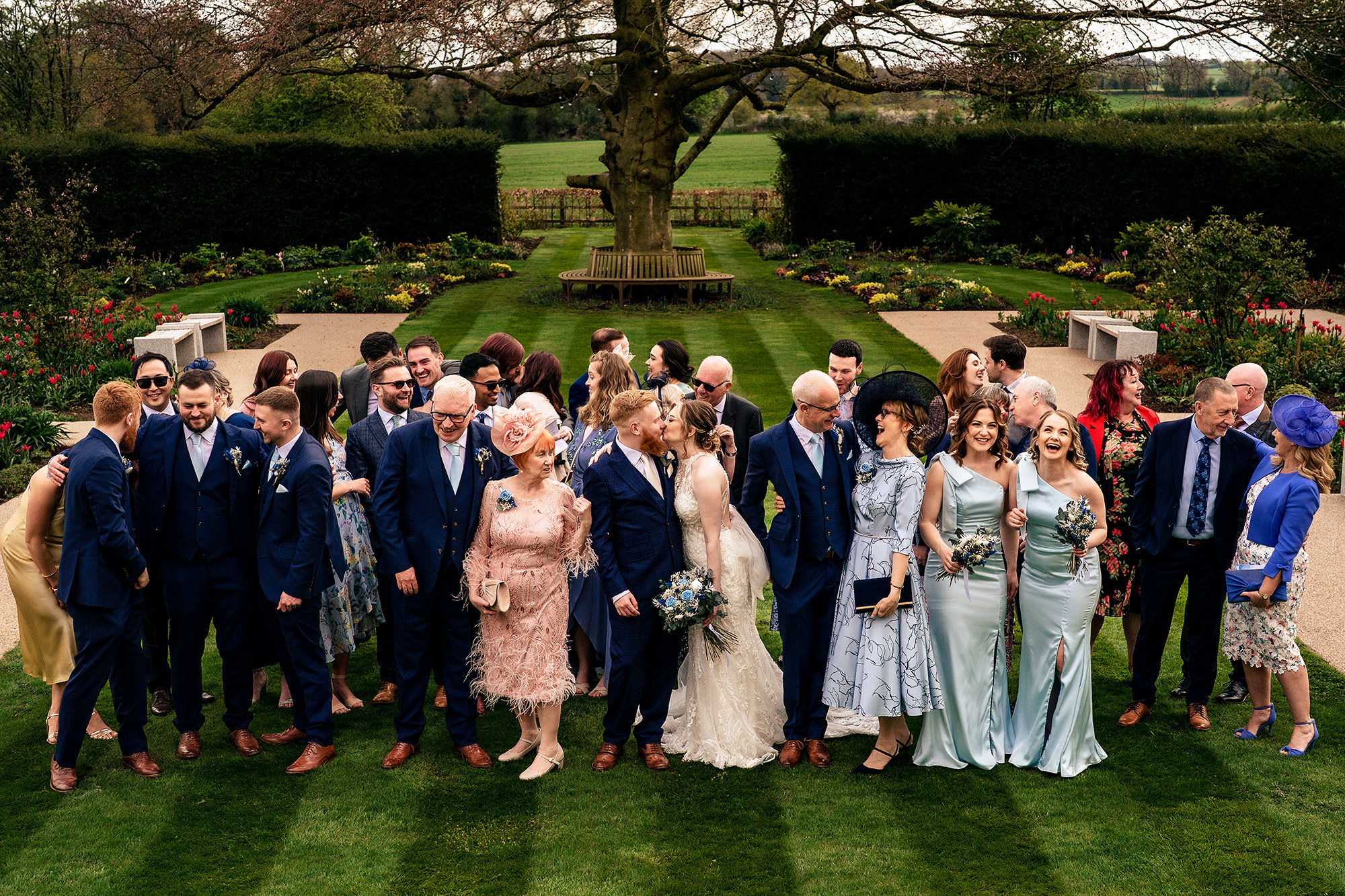 The whole wedding party gathered in the gardens at Salt House, Staffordshire wedding photographer