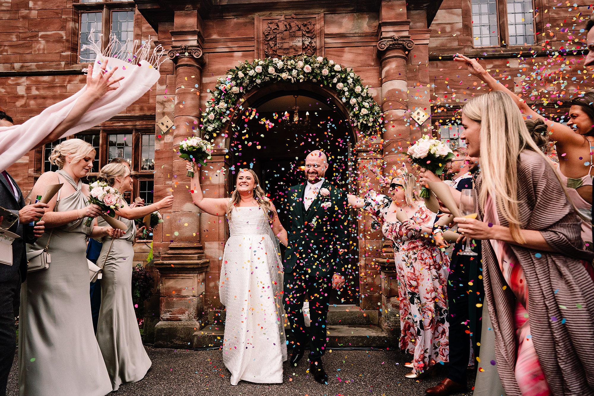 Confetti thrown for Chloe and Pete again on arrival at Wrenbury Hall