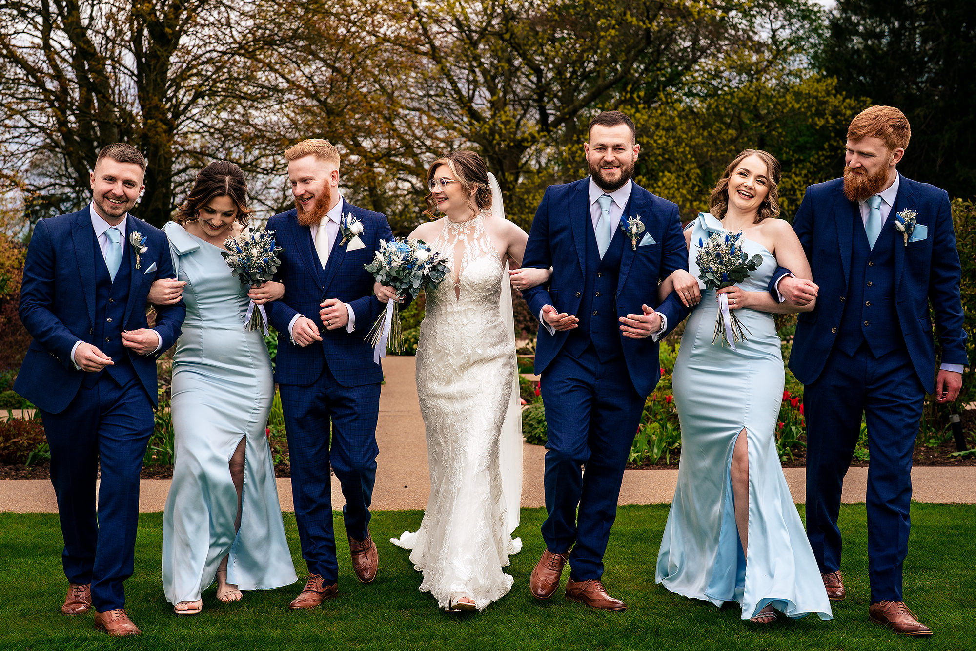 Bridesmaids and groomsmen together in the Salt House gardens, Staffordshire wedding photographer