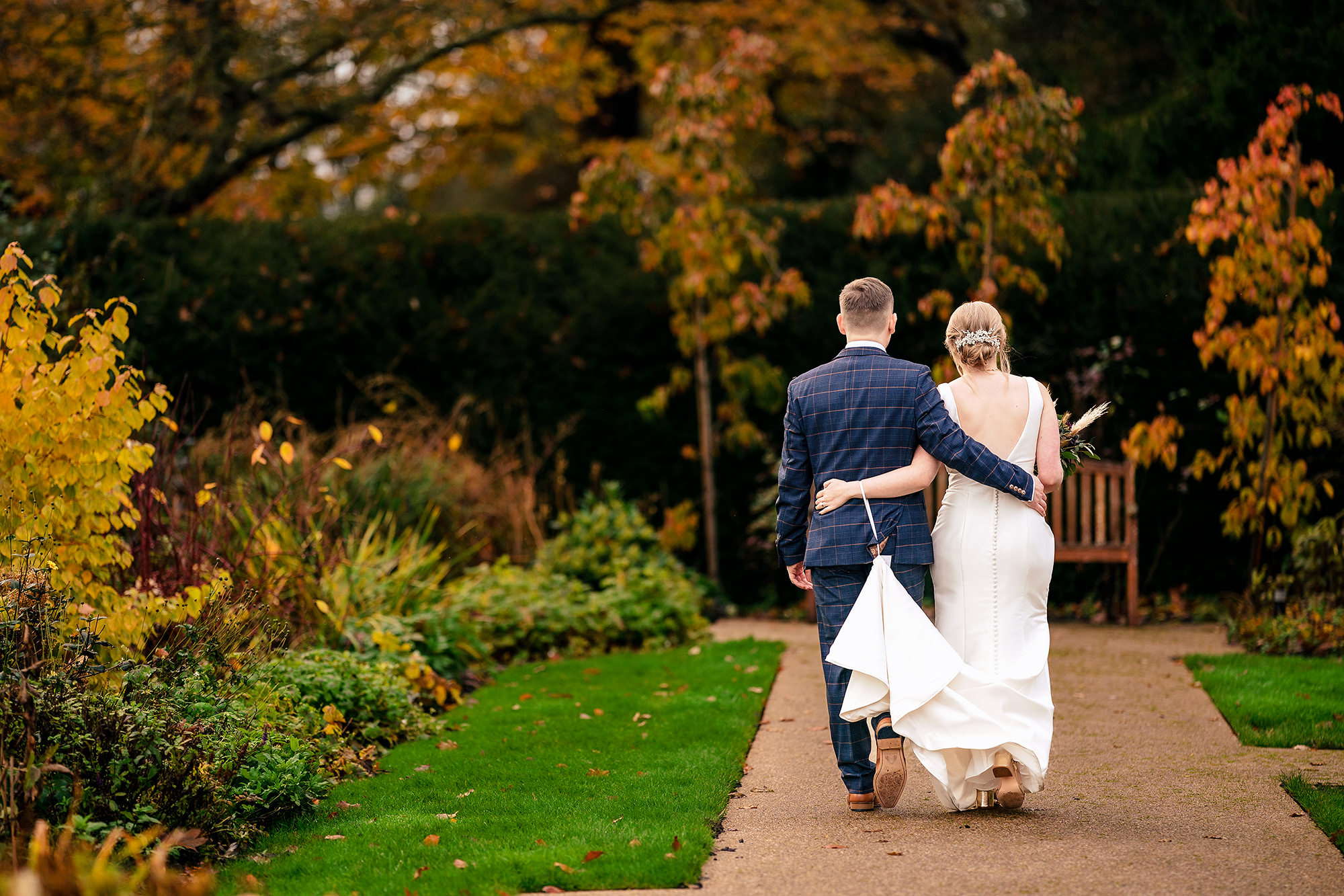 Chloe and Dan walking through the Salt House gardens as the light started to turn