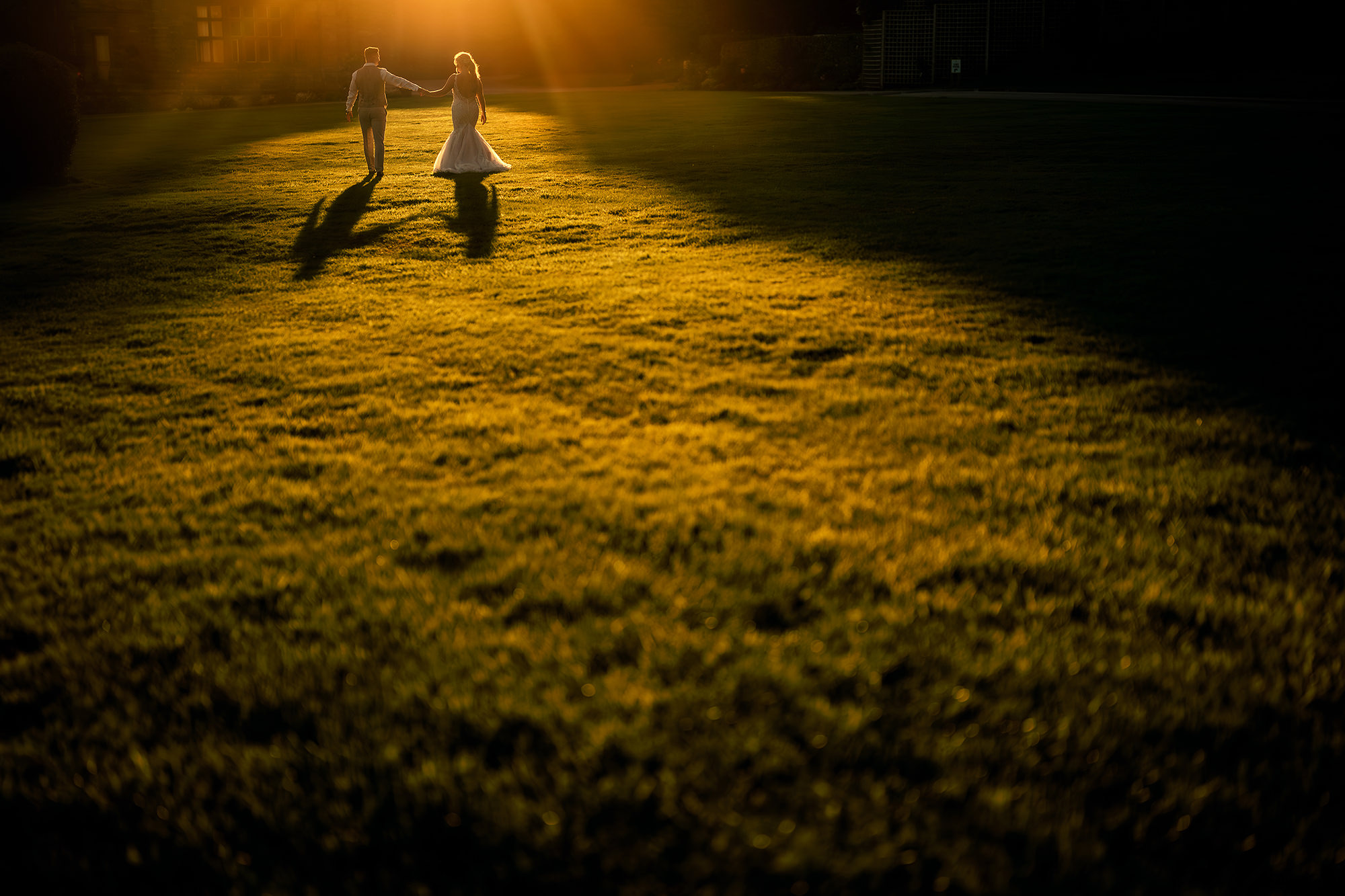 Jess and Cy walking into the sunset at Salt House, Staffordshire wedding photography