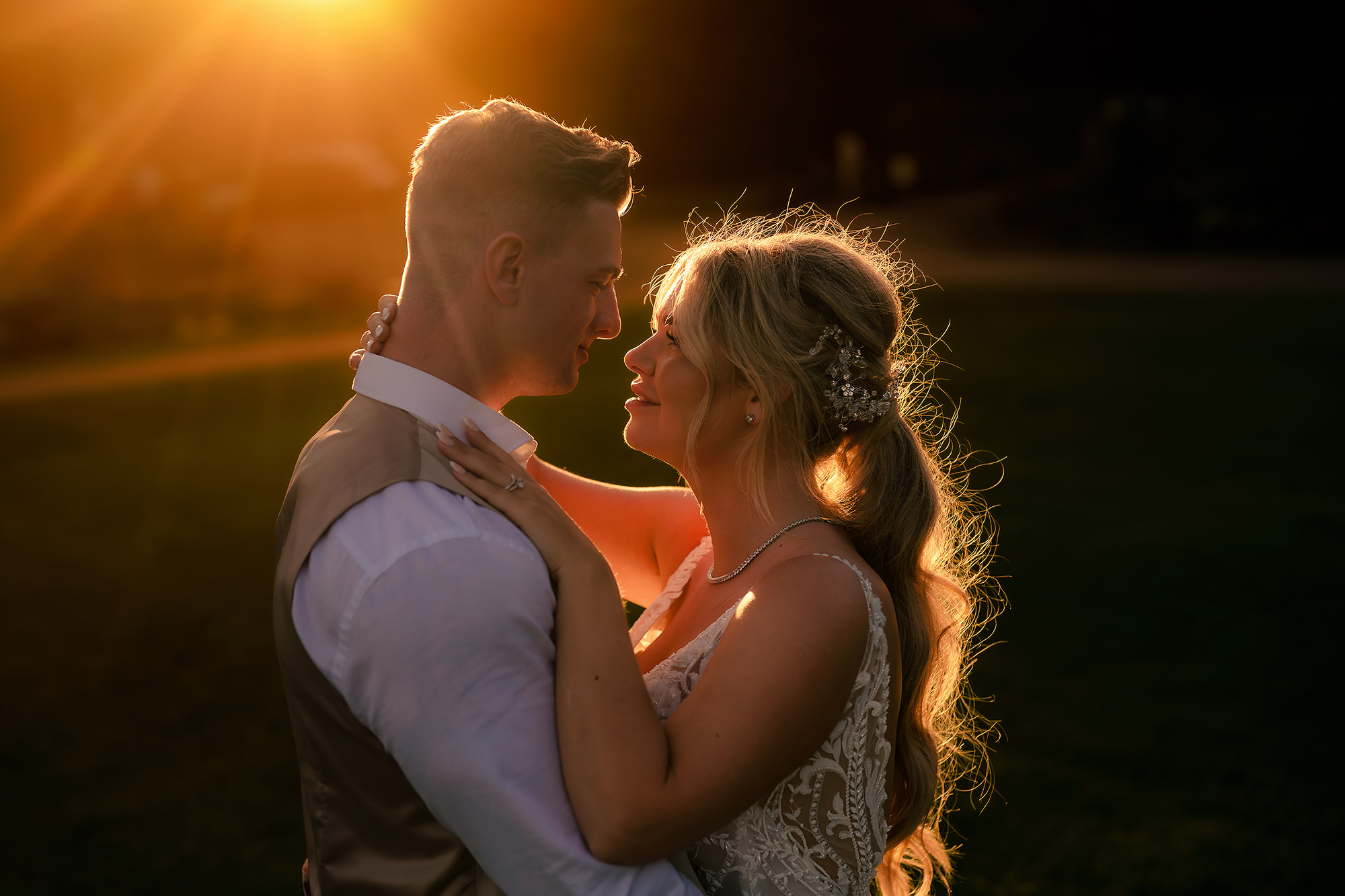 Jess and Cy sharing a golden hour kiss at Salt House, Staffordshire