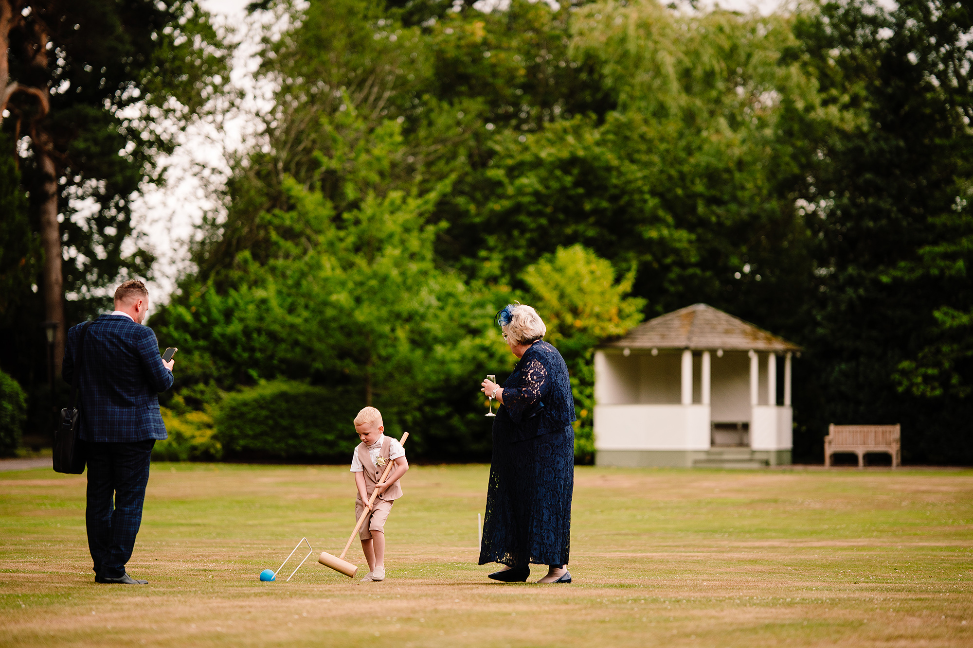 One of the littlest guests playing chase on the lawn at Wrenbury Hall