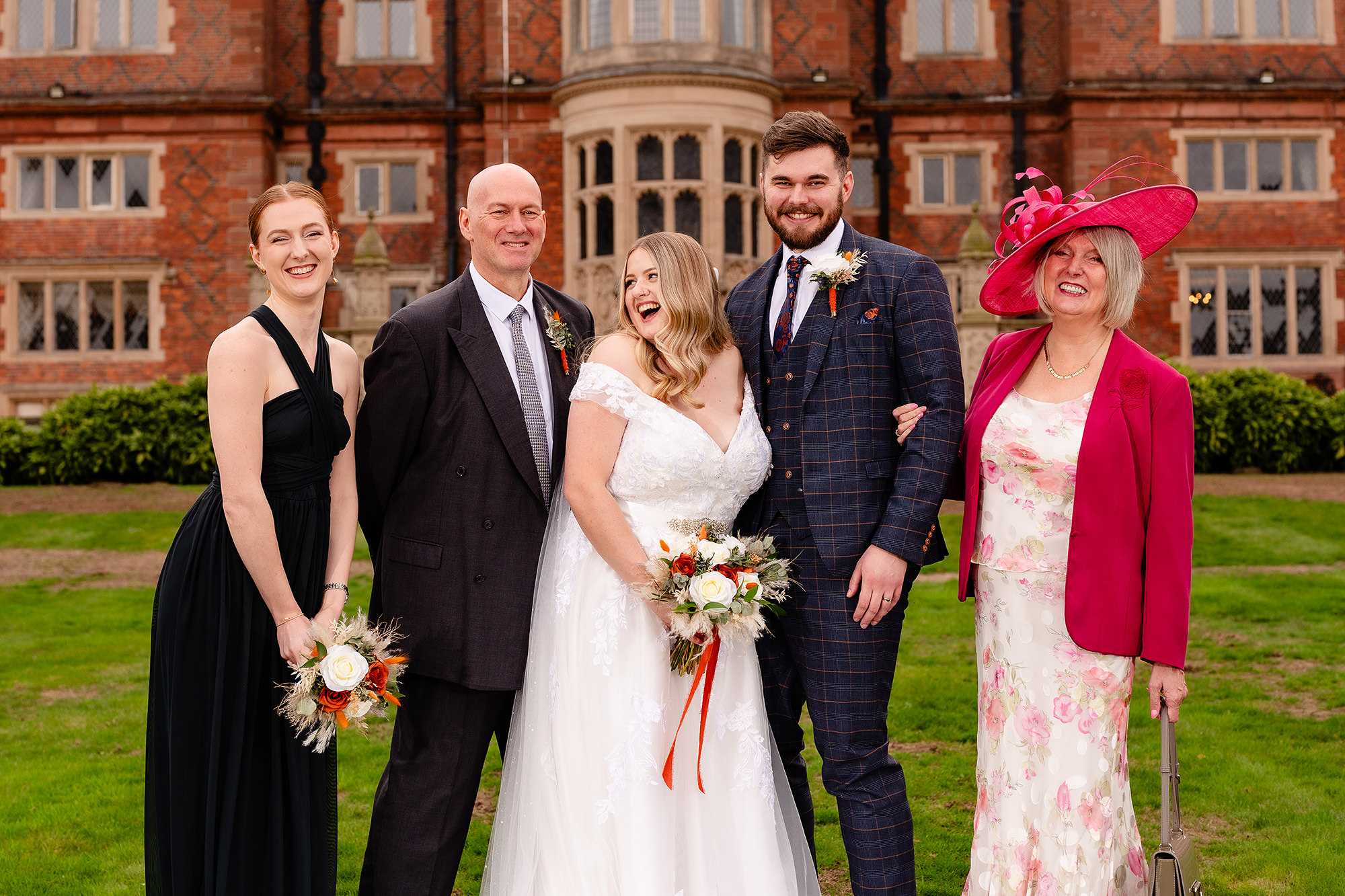 Tom with his parents and sister for the family formal photo at Crewe Hall, Cheshire wedding photographer