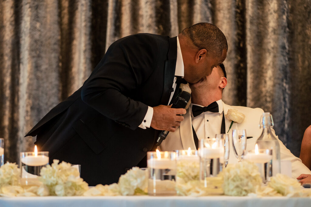 Tyrone’s dad leaning down to kiss Tyrone after his speech