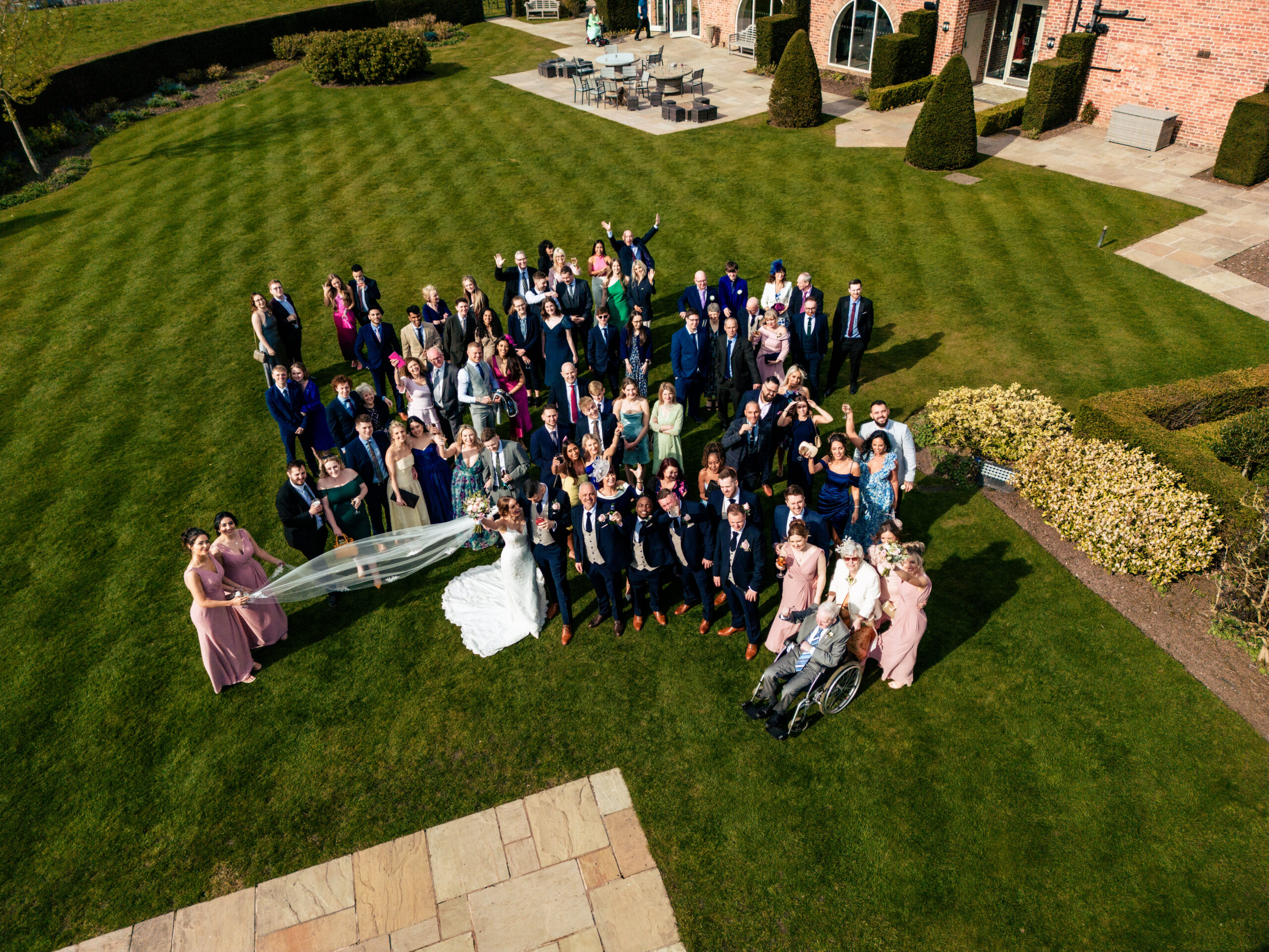 Drone photo of every wedding guest together on the lawn at Merrydale Manor