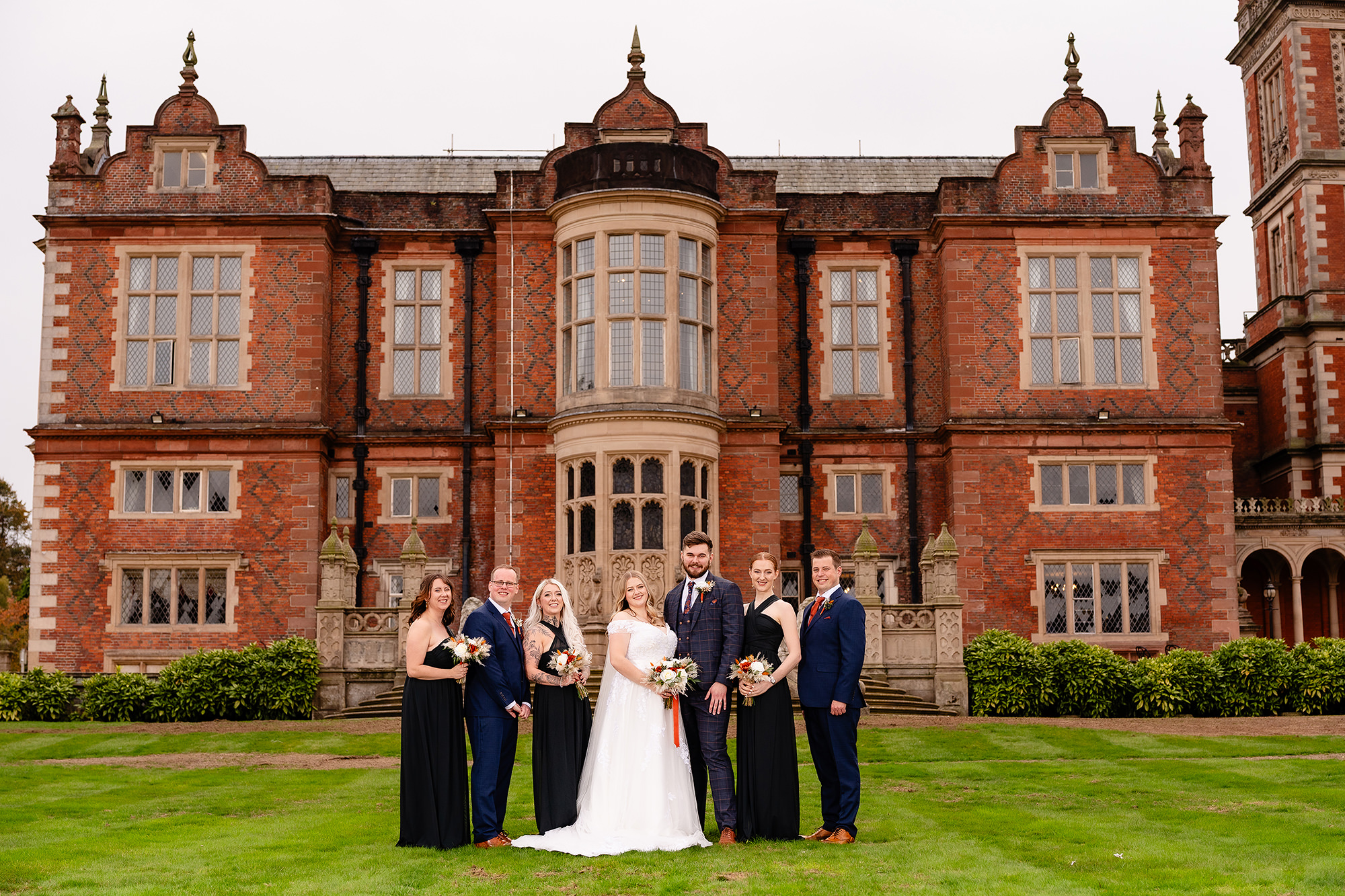 Another family formal photograph taken on Crewe Hall’s lawn, Cheshire wedding photographer