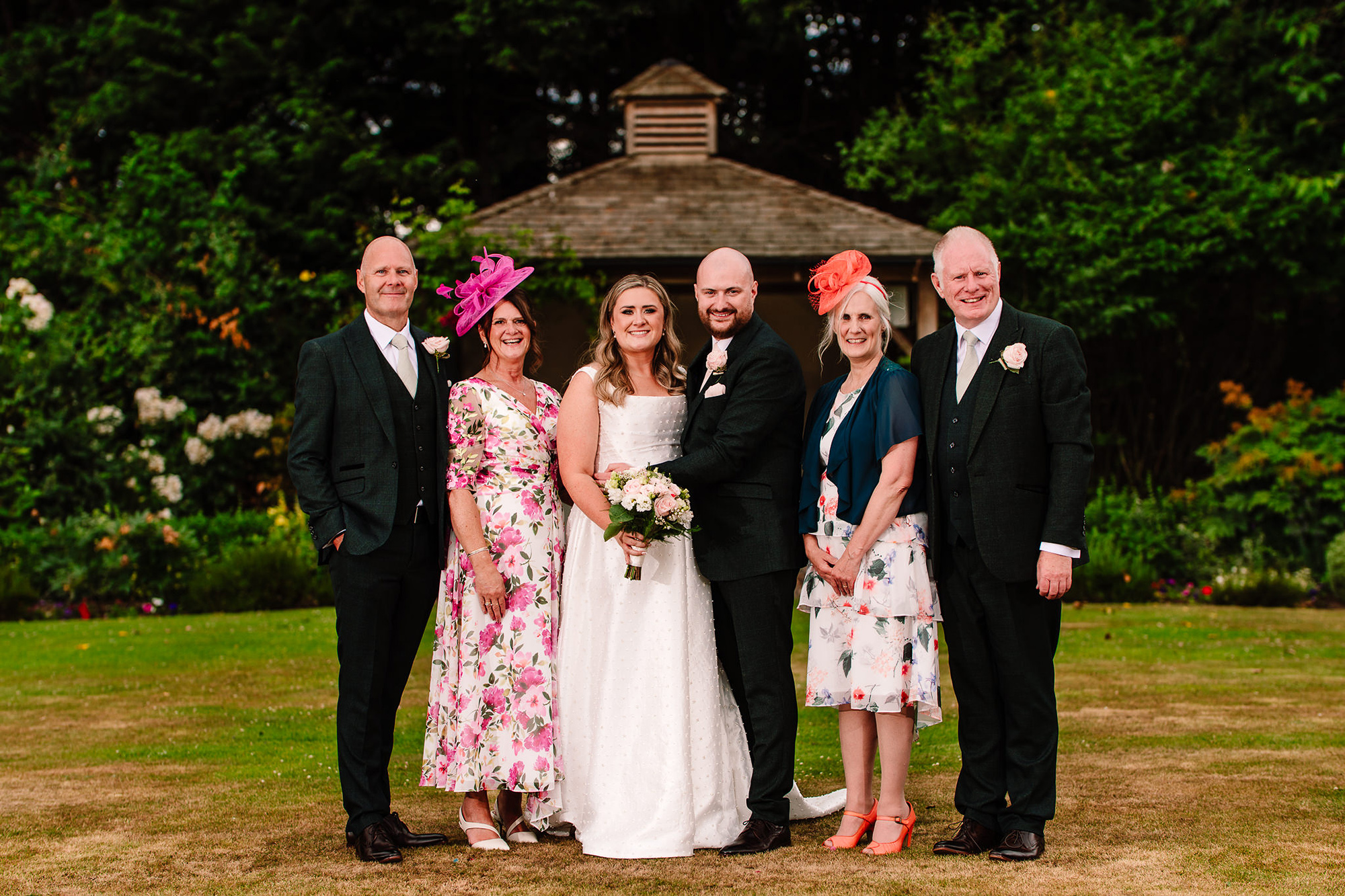 A family formal photograph under the gazebo at Wrenbury Hall