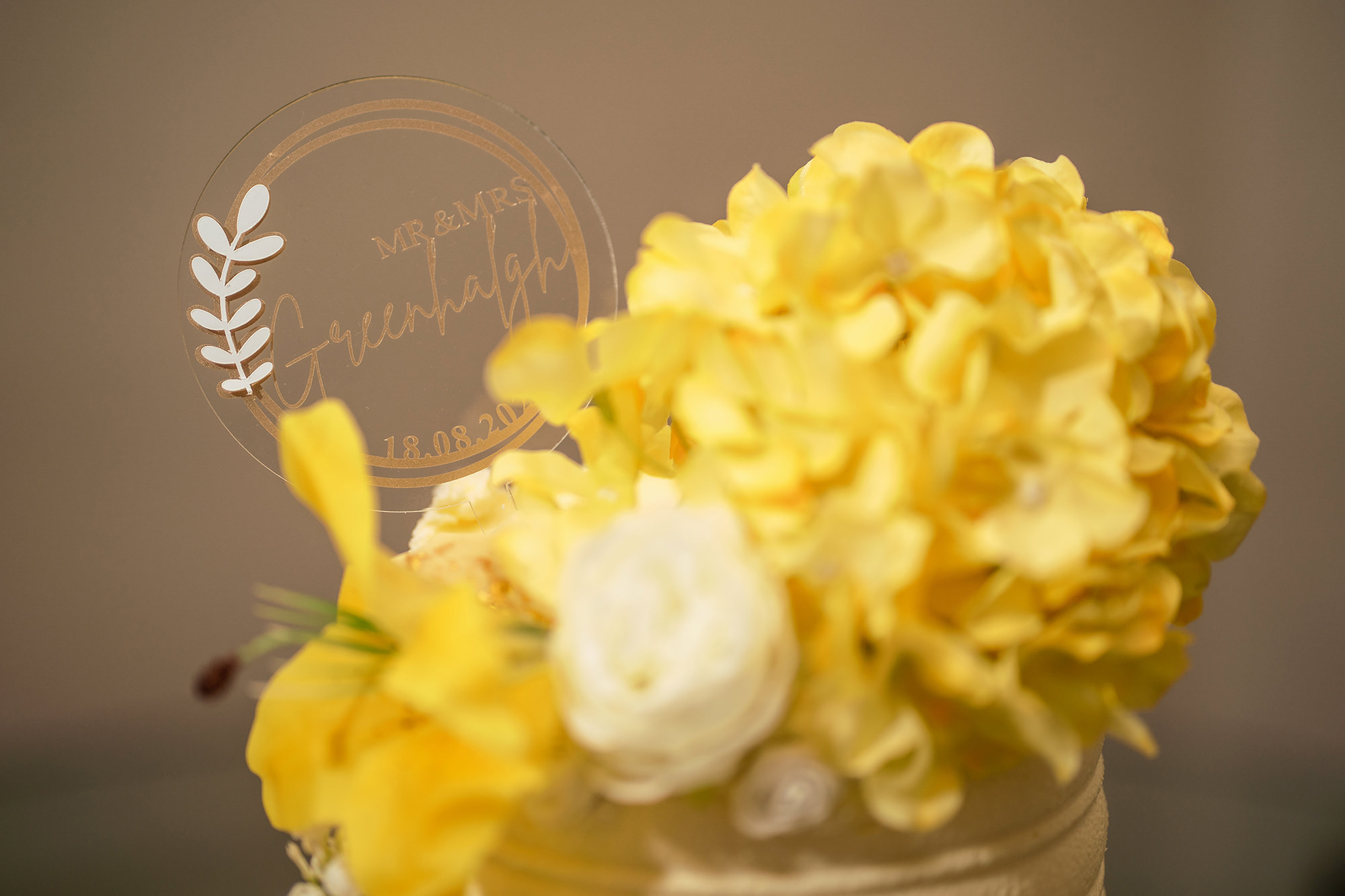 The wedding cake with yellow flowers to match the day, Merrydale Manor wedding photographer
