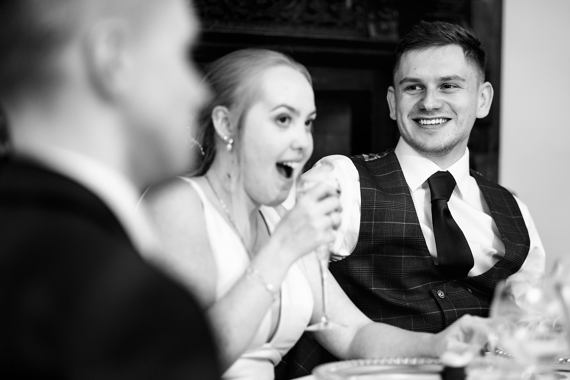 Chloe and Dan feeding each other mid toast during the speeches