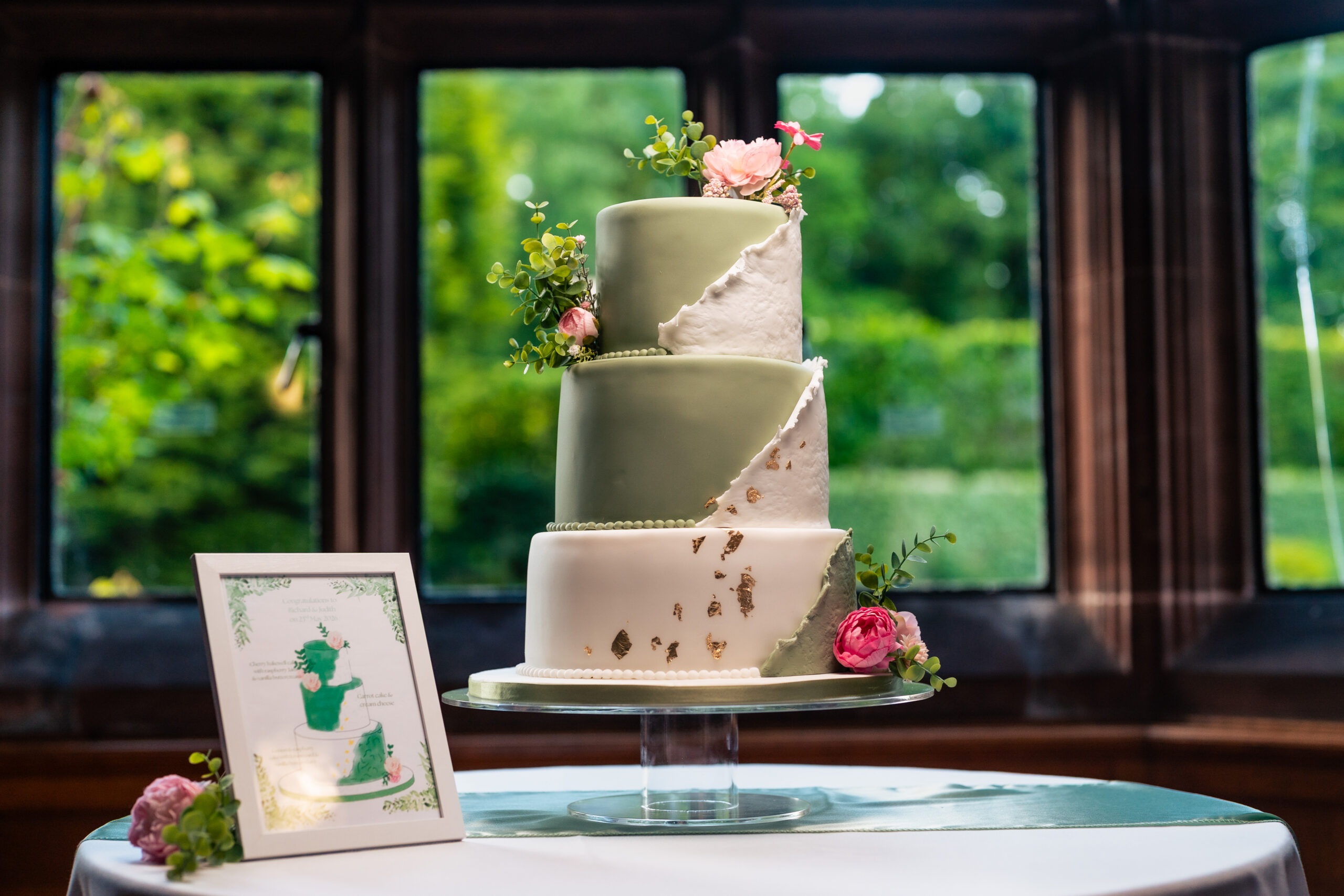 Three tier wedding cake on display at Salt House ahead of the cake cutting