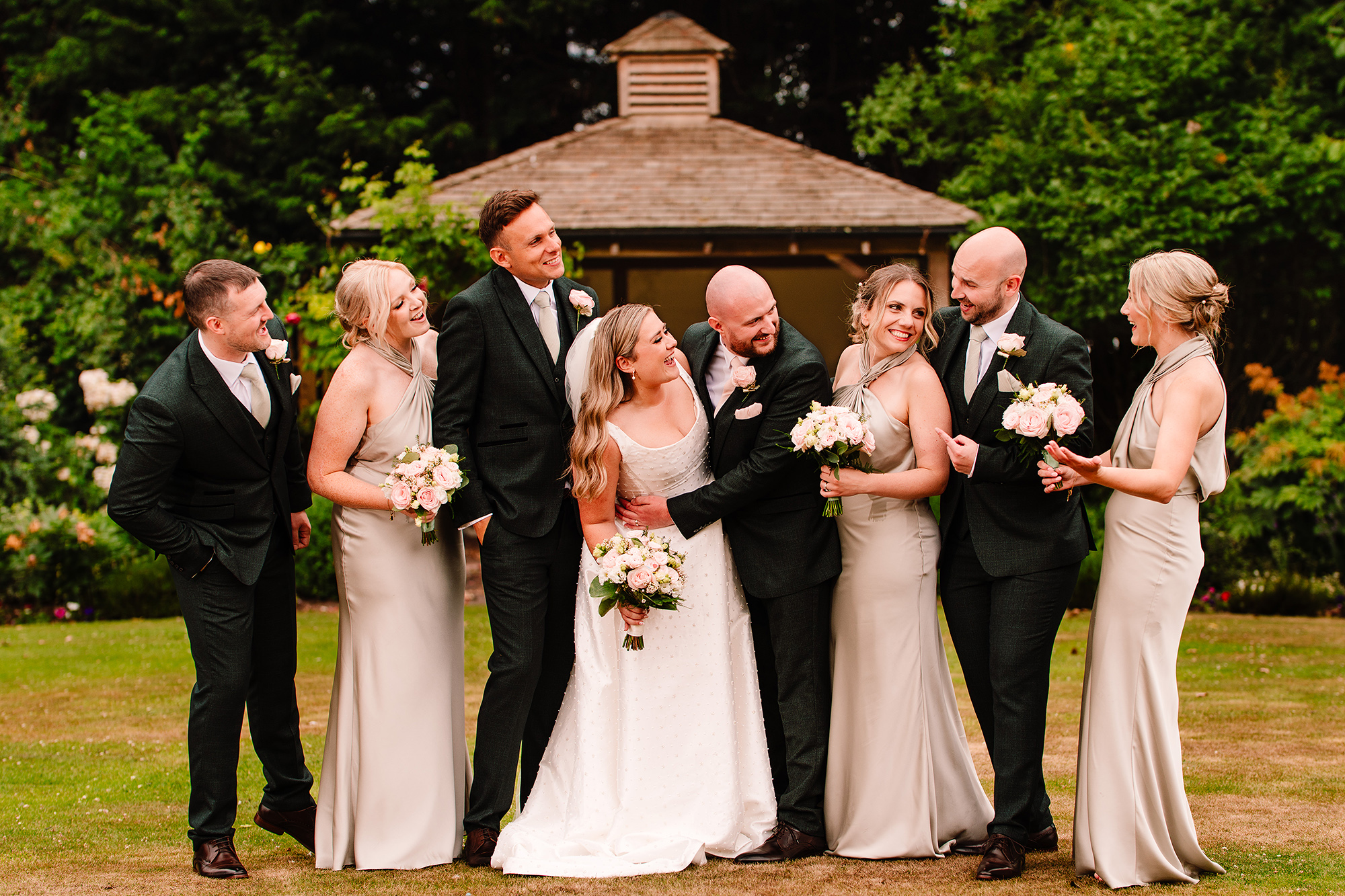 The full wedding party gathered for the group photo at Wrenbury Hall