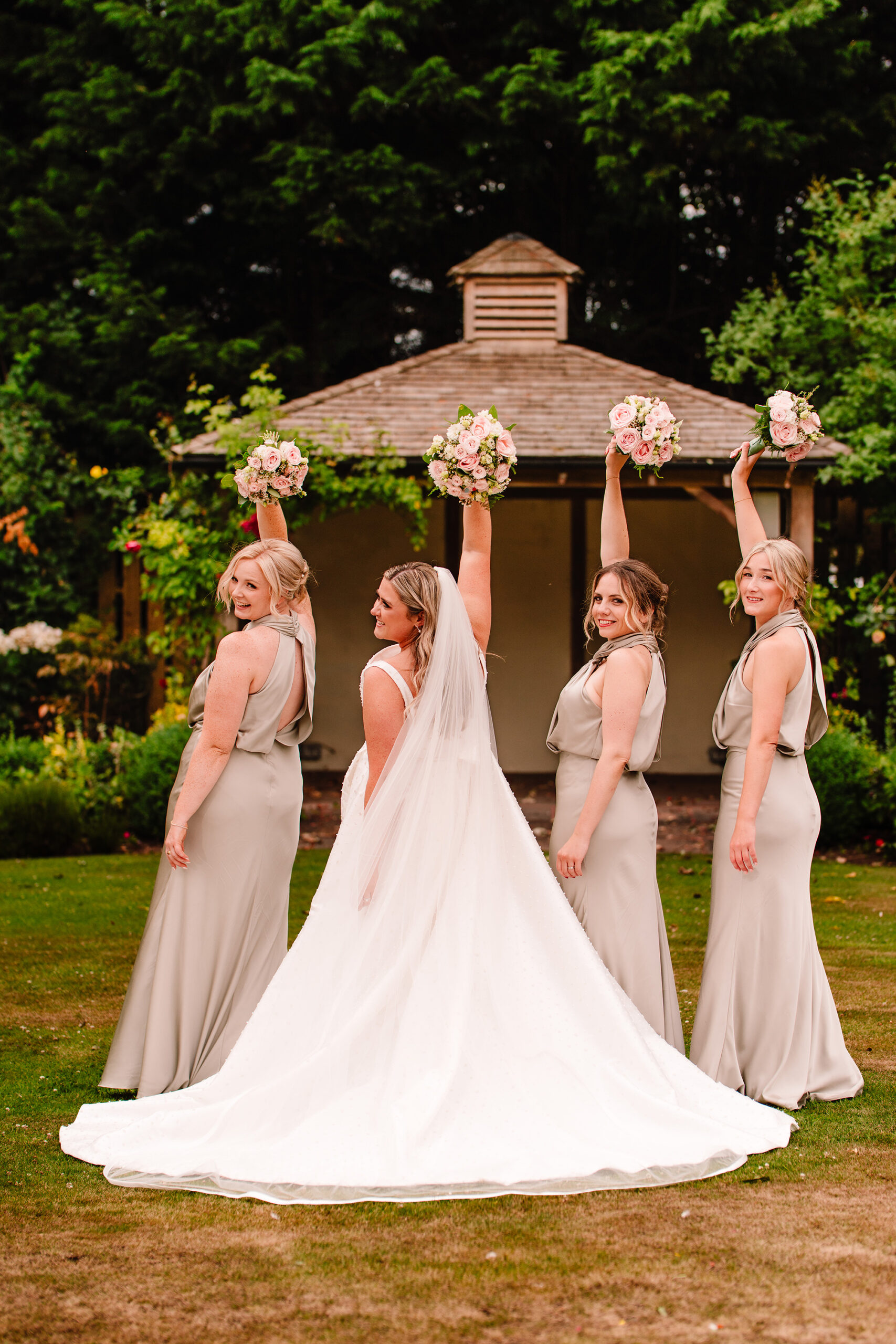Chloe and her bridesmaids together under the gazebo at Wrenbury Hall