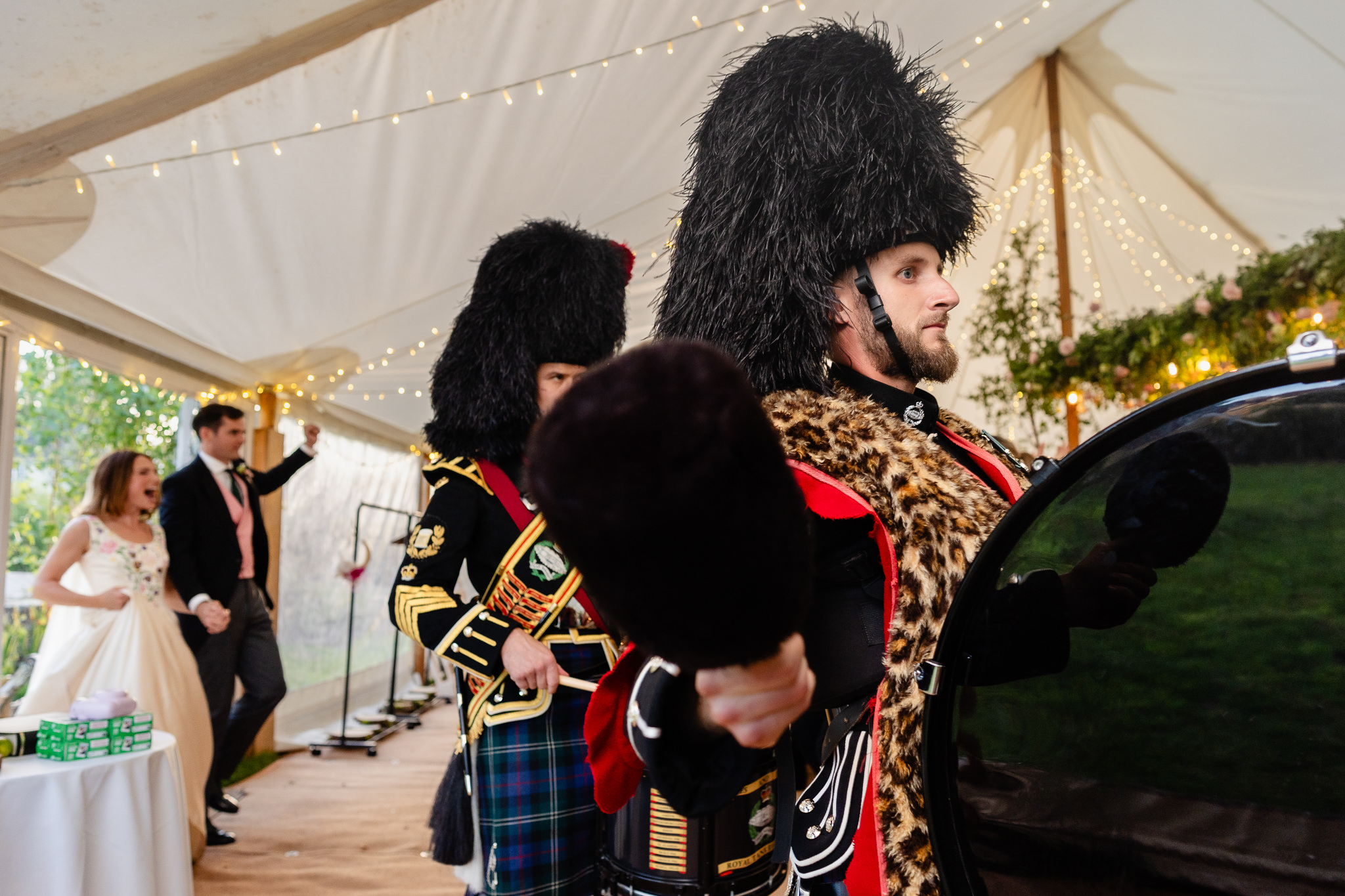 Pipes and drums performing inside the marquee during the wedding breakfast