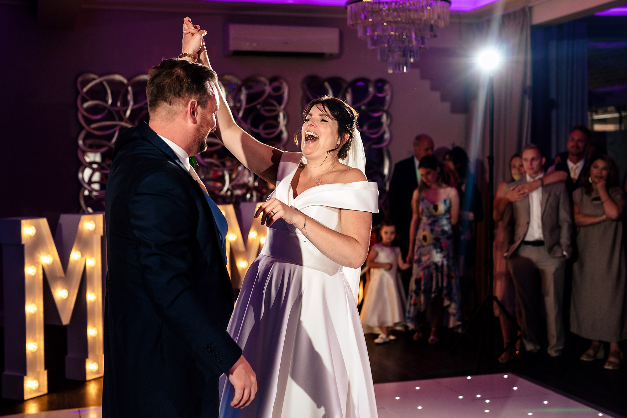 Laura and Ryan's first dance in front of the light up letters, Merrydale Manor wedding photographer