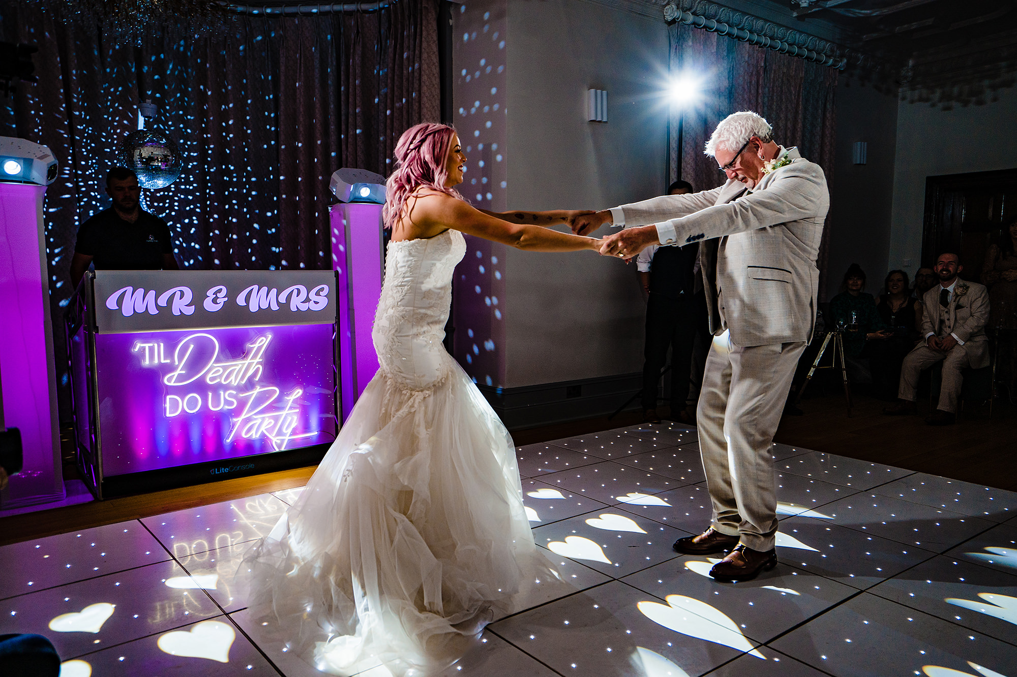 Bride and her dad mid spin during their father daughter dance at Standon Hall