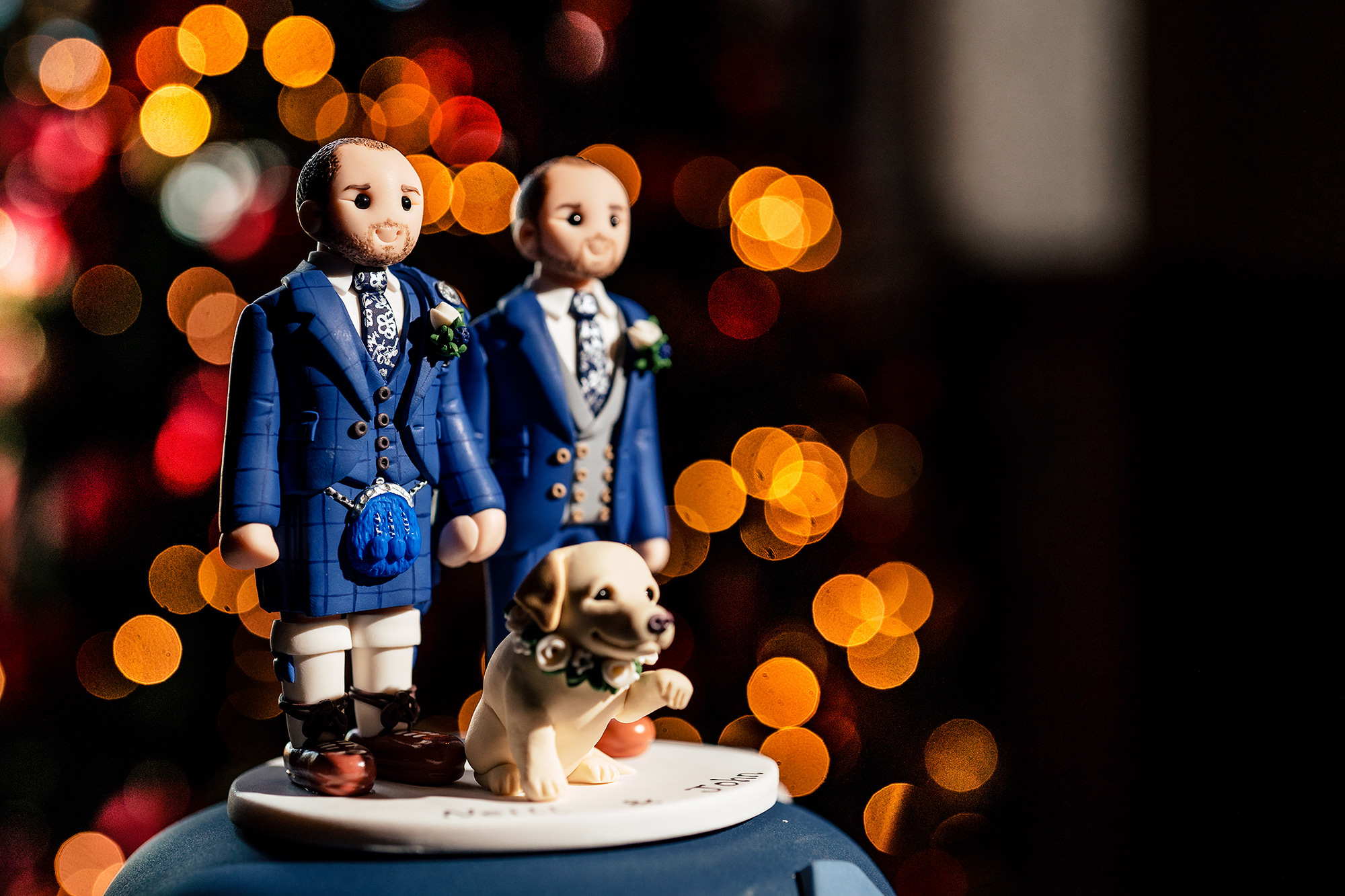 A personalised Mr and Mr cake topper, complete with a model of Sula, on the wedding cake at Crewe Hall