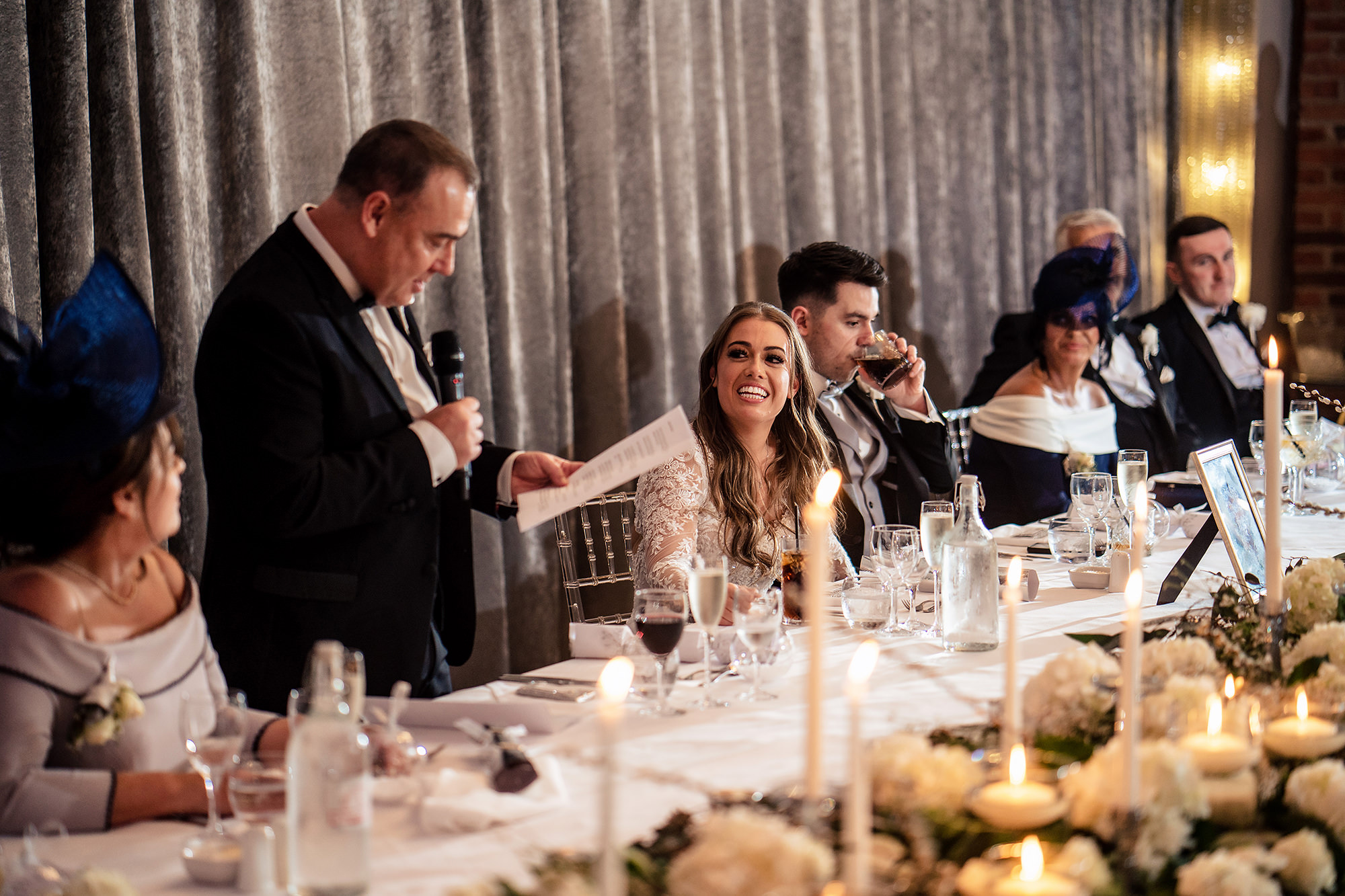 Abbie’s dad giving his speech at the candlelit top table, Merrydale Manor wedding photographer