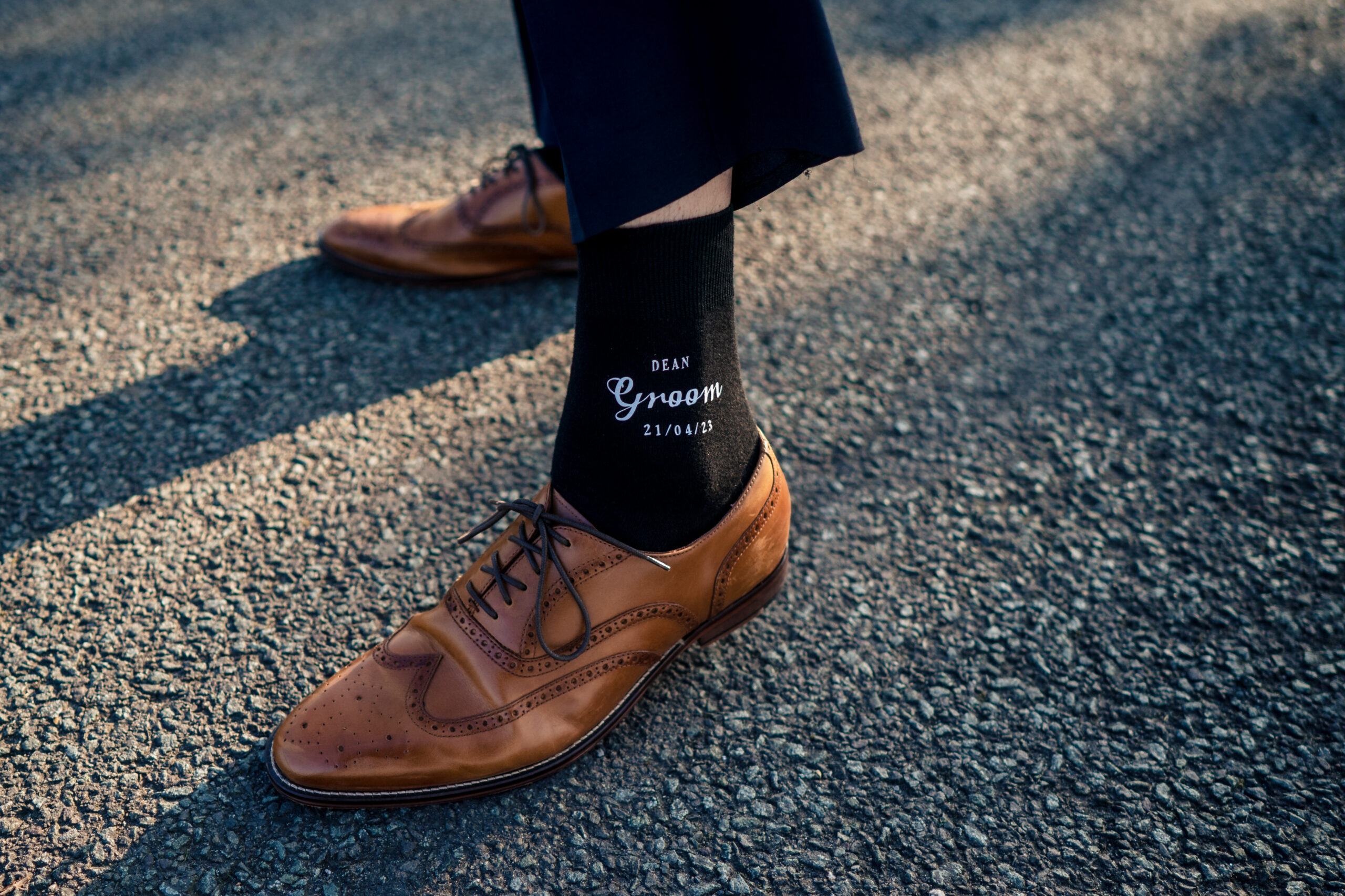 Dean's black socks printed Dean Groom 21/04/23 with tan brogues