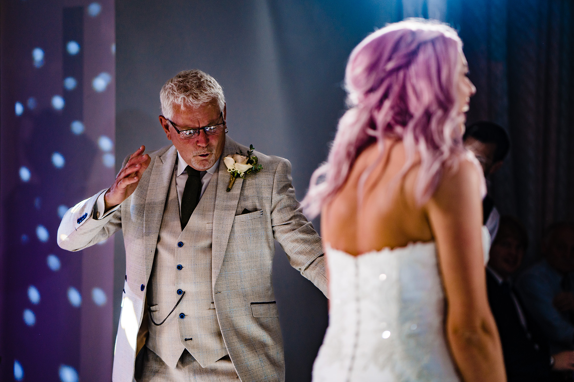 Bride and her dad in a close embrace during their father daughter dance at Standon Hall