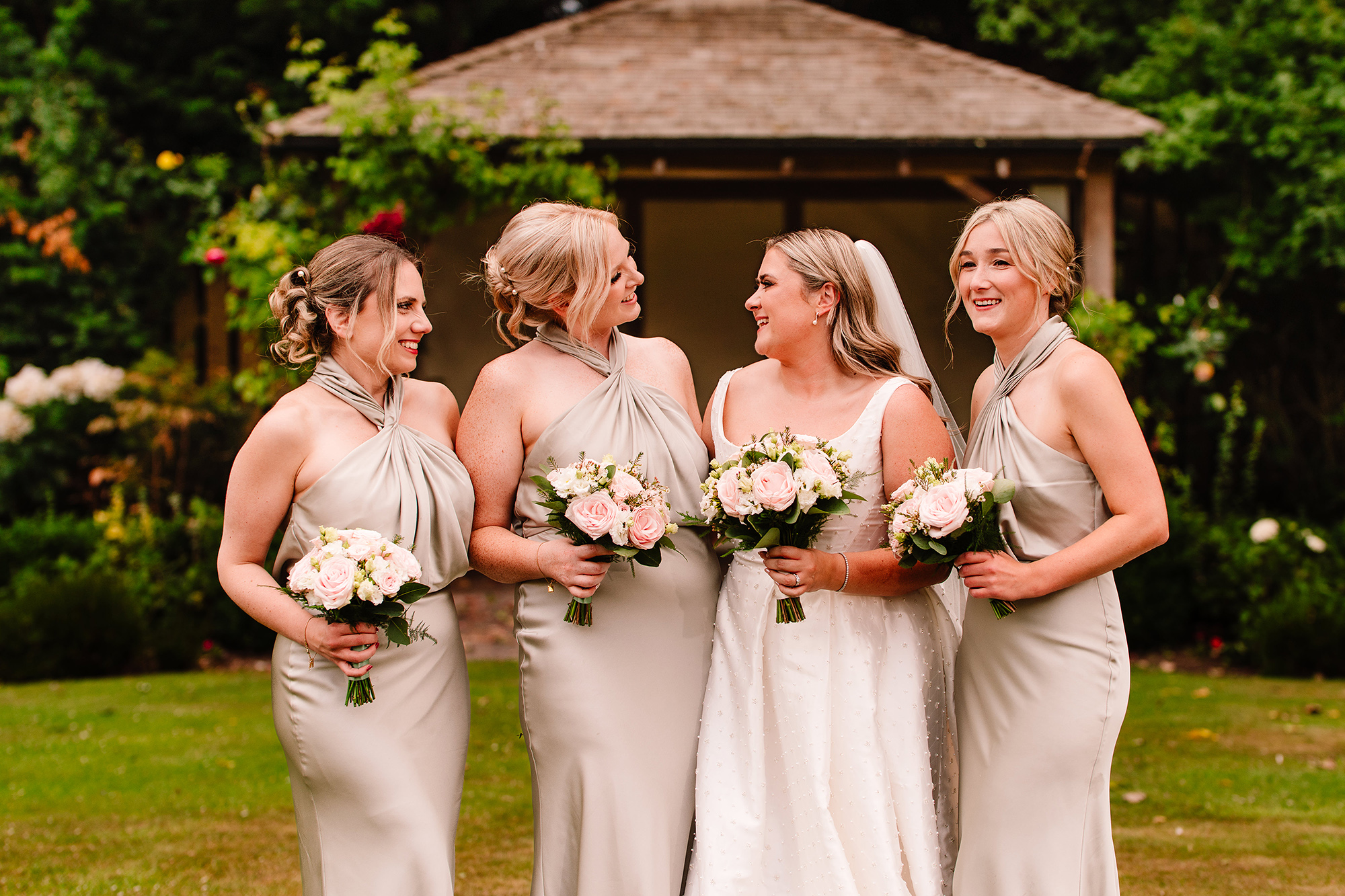 Chloe’s bridesmaids laughing together at Wrenbury Hall