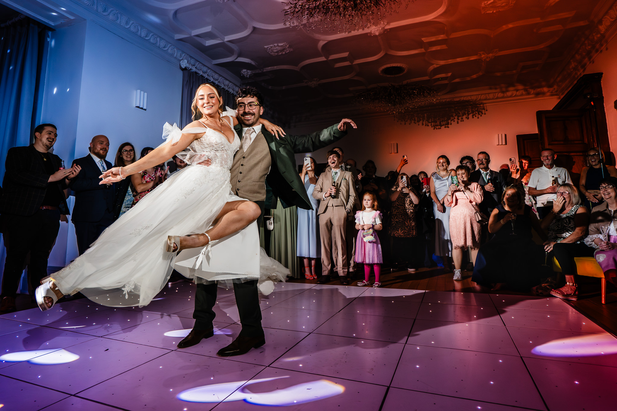 The bride being lifted and spun on the dance floor as the evening party gets going at Salt House