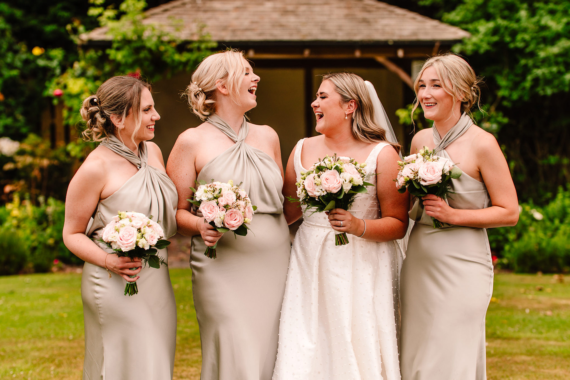 Another candid of Chloe’s bridesmaids laughing together at Wrenbury Hall