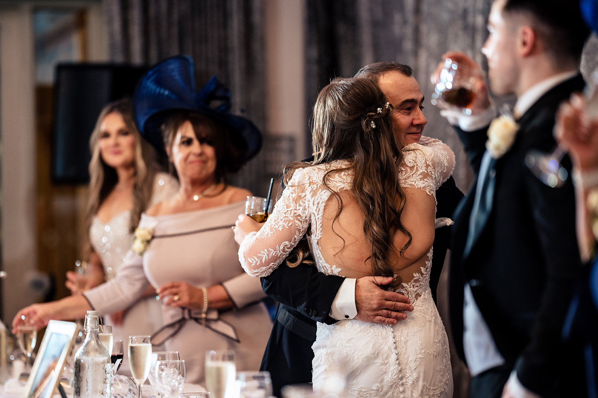 Abbie hugging her dad after his speech at the top table, Cheshire wedding photographer