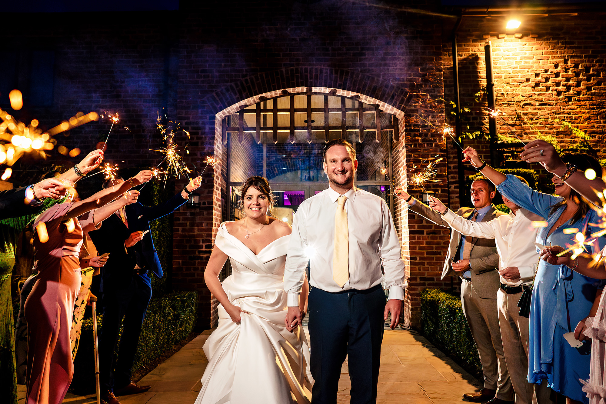 Guests forming a sparkler tunnel for the send off, Merrydale Manor wedding photographer
