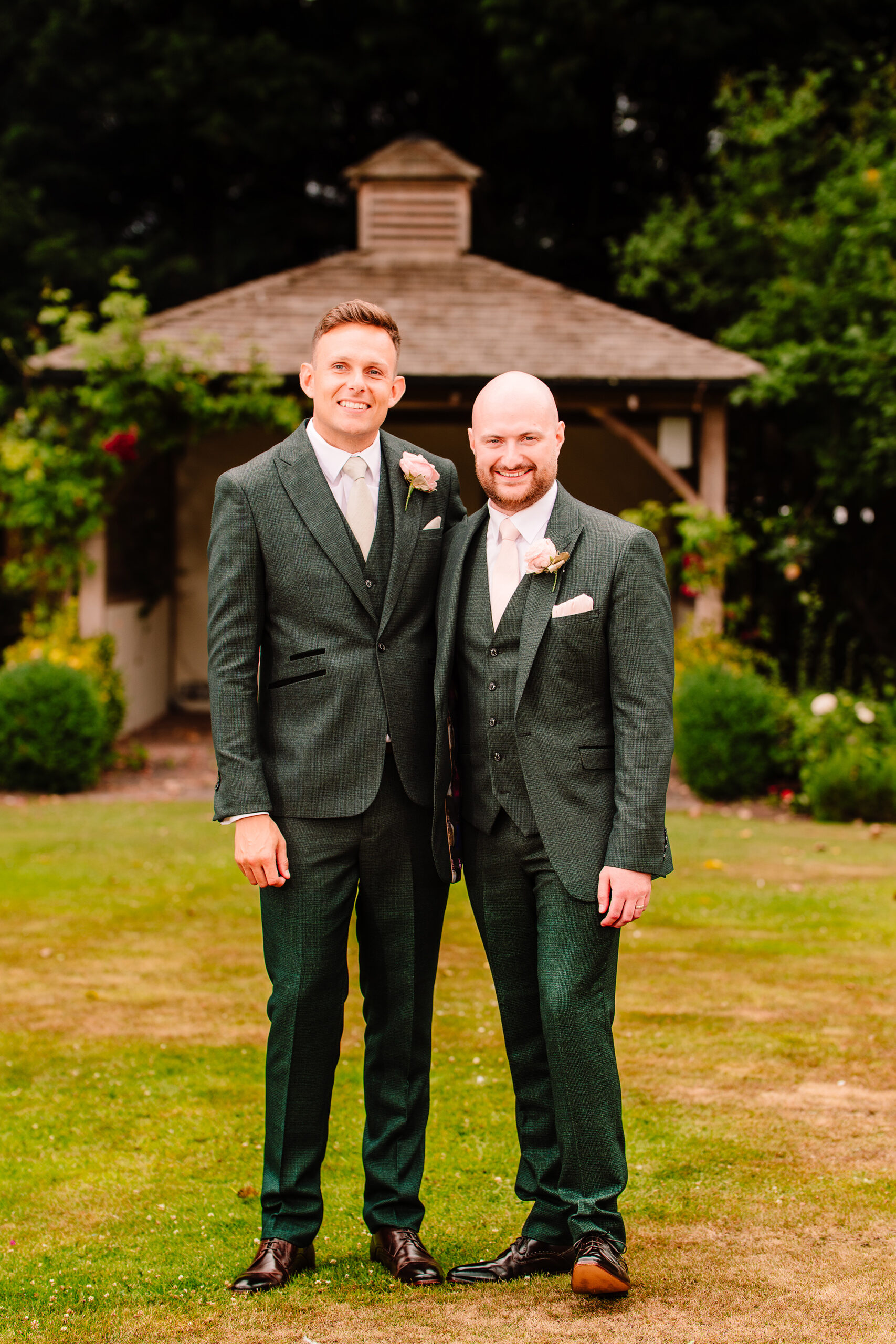 Pete and one of his groomsmen sharing a relaxed portrait at Wrenbury Hall