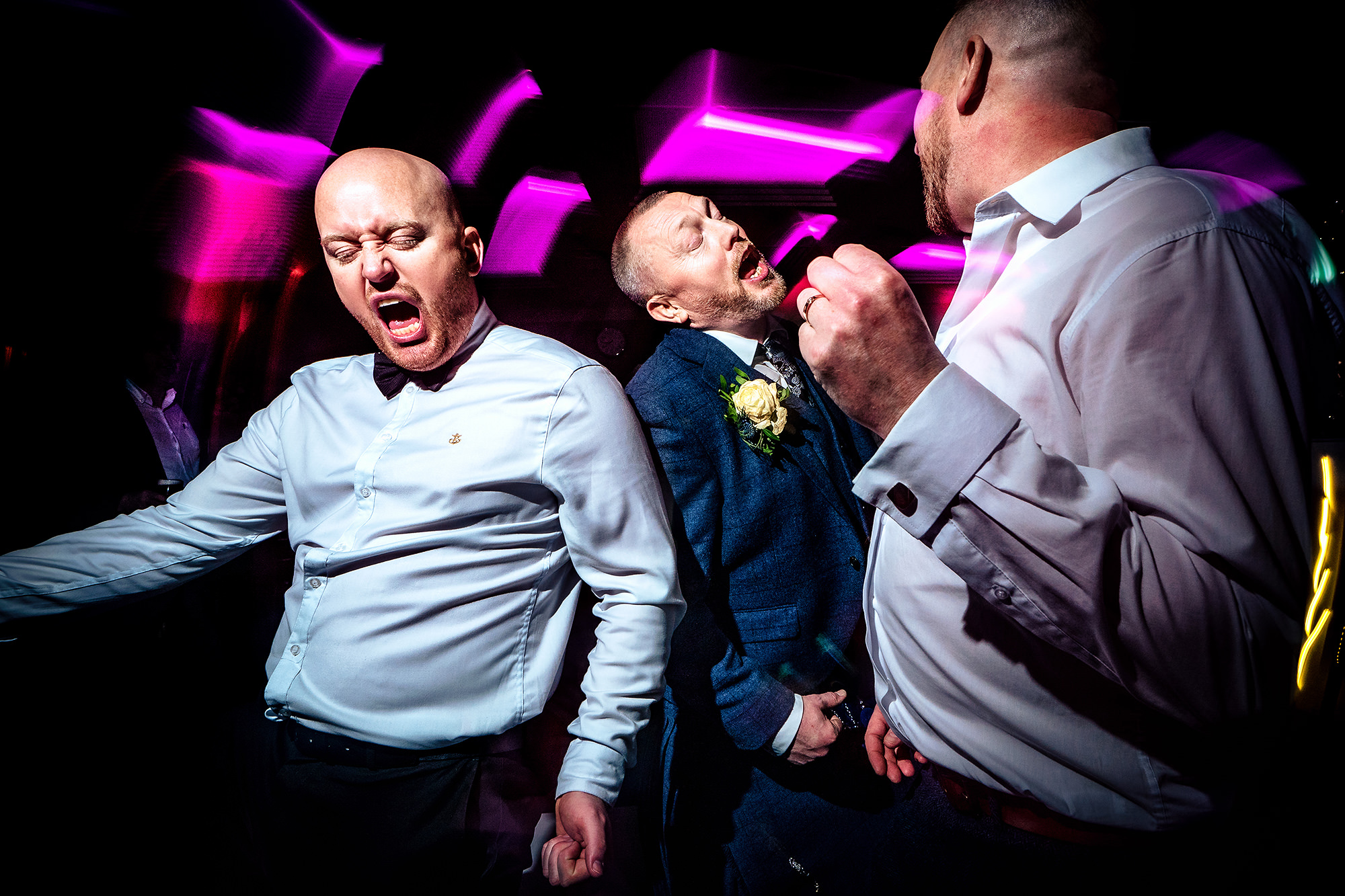 Friends singing along together during the evening party