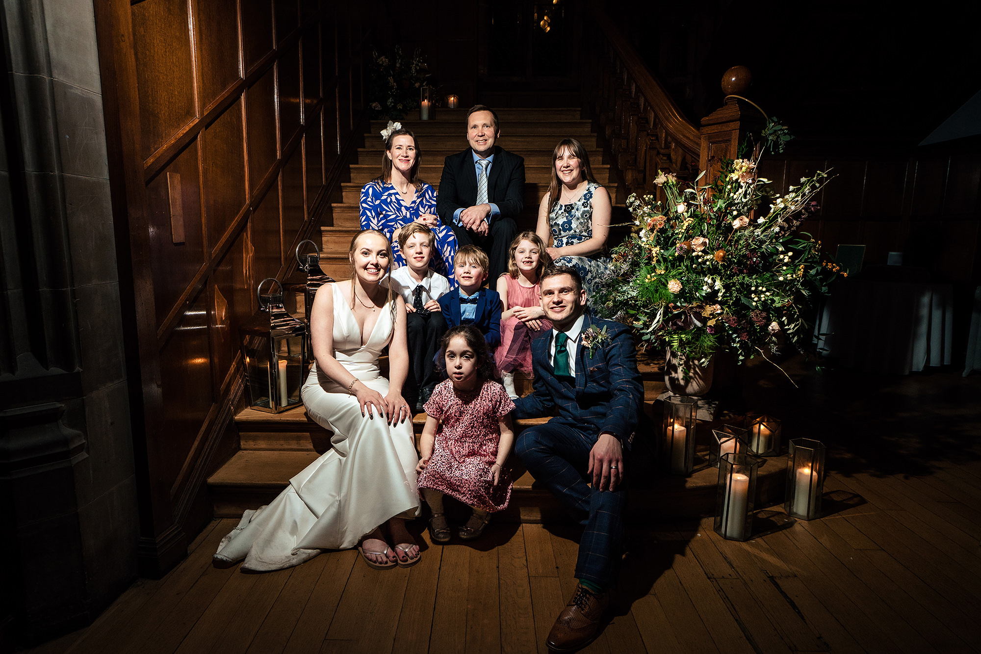 A family portrait on the candlelit Salt House staircase