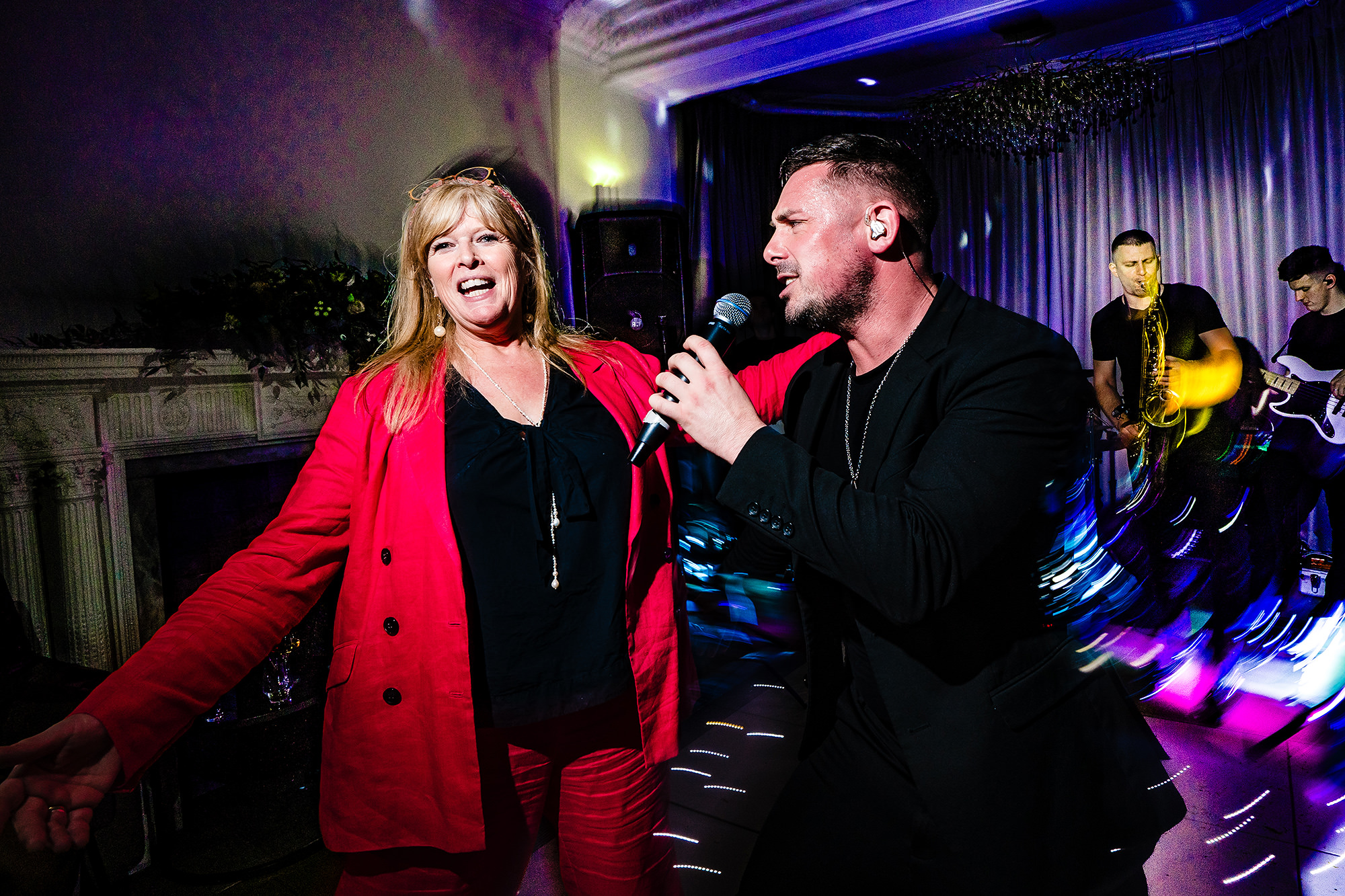 A guest grabbing the microphone on the Salt House dance floor