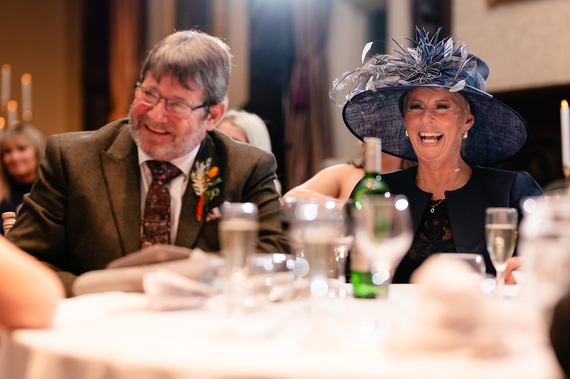 Annie’s parents laughing together during the speeches, Crewe Hall wedding photographer